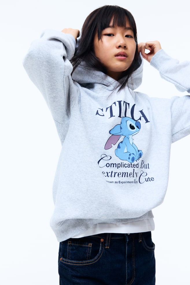 Hoodie with Motif - Gray melange/Lilo & Stitch/Dark brown/SmileyWorld®/Red/The Grinch/Dark red/Snoopy/Light gray melange/Cinnamoroll/Cream/The Rolling Stones/Gray melange/SmileyWorld®/Purple/Kuromi/Pink/Lilo & Stitch - 2