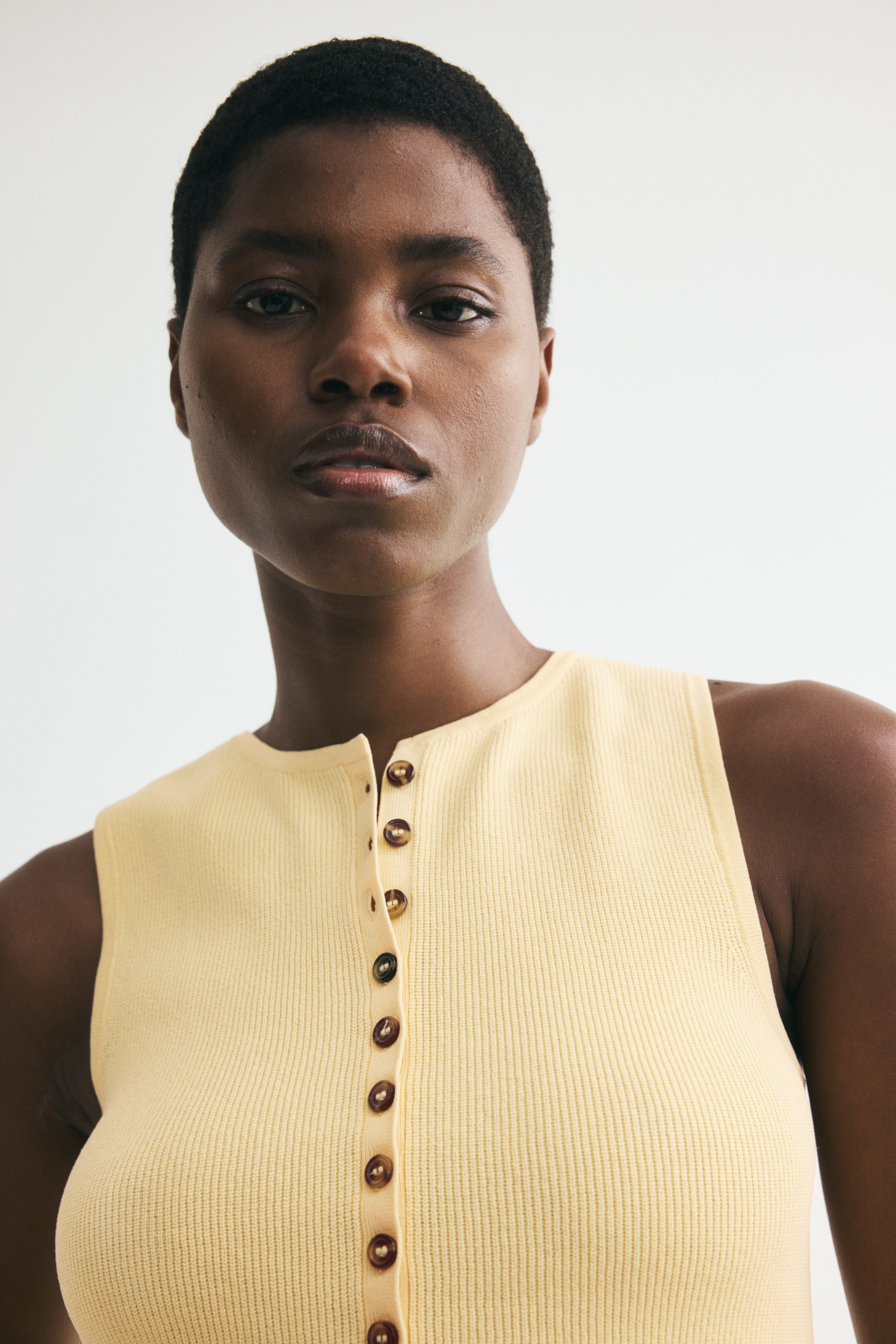 Rib-Knit Peplum Sleeveless Top