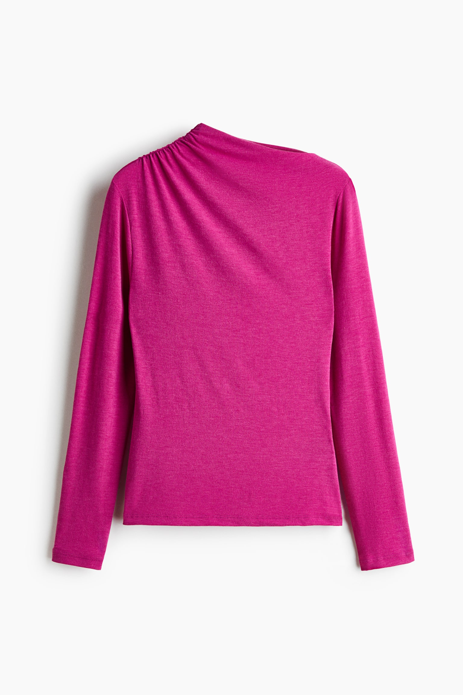 A magenta long-sleeved top is shown from the front, featuring an asymmetrical neckline with gathered ruching on one shoulder, creating a diagonal drape across the chest. The top has fitted long sleeves and a straight hemline.