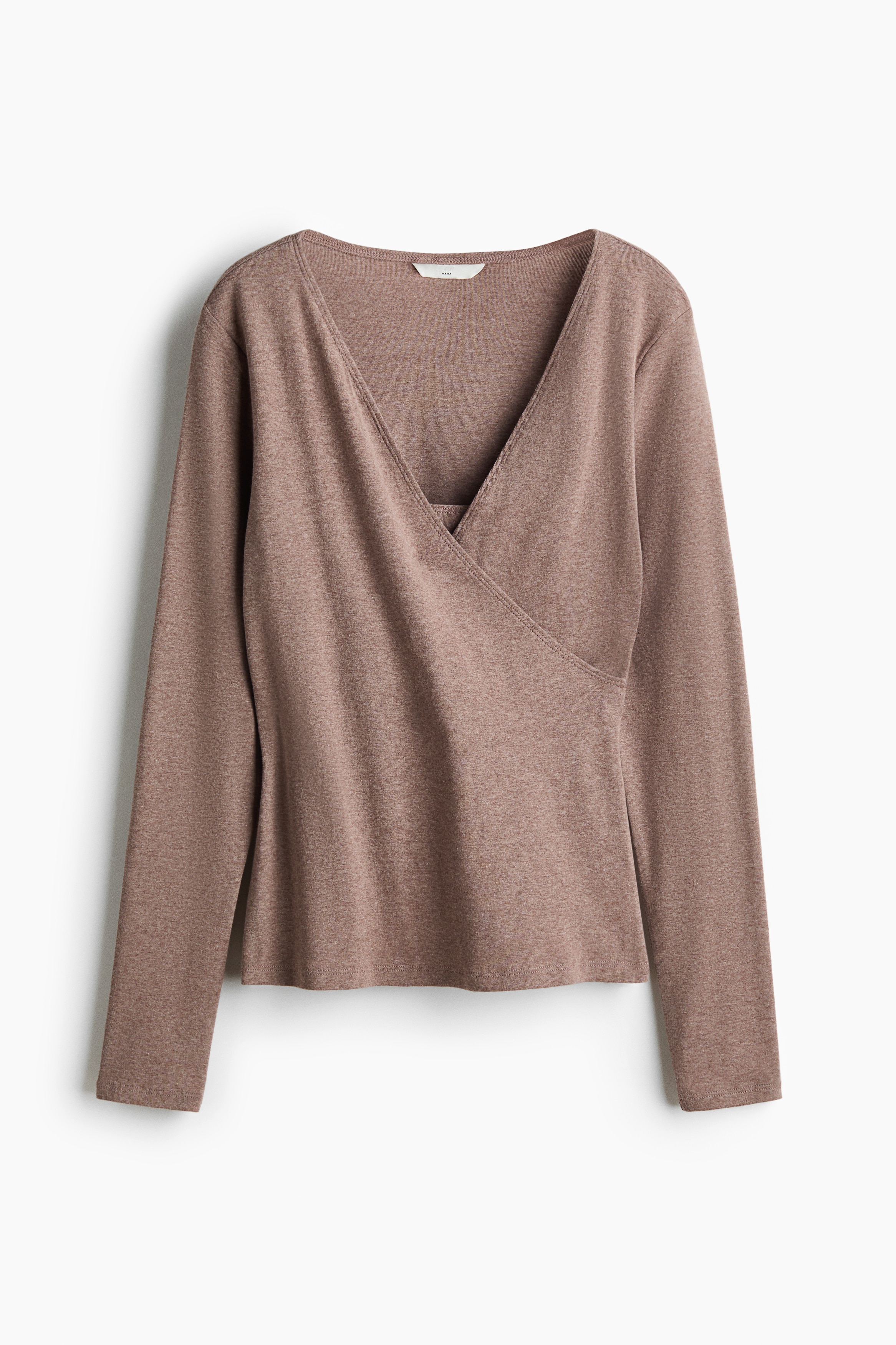 A heathered taupe long-sleeved wrap top is featuring a V-neckline and a gathered detail at the left side of the waist, fitting snugly above blue jeans.