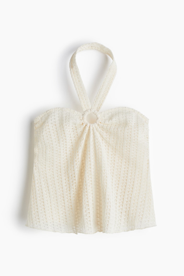 Bluza od rupičastog žerseja s halter izrezom