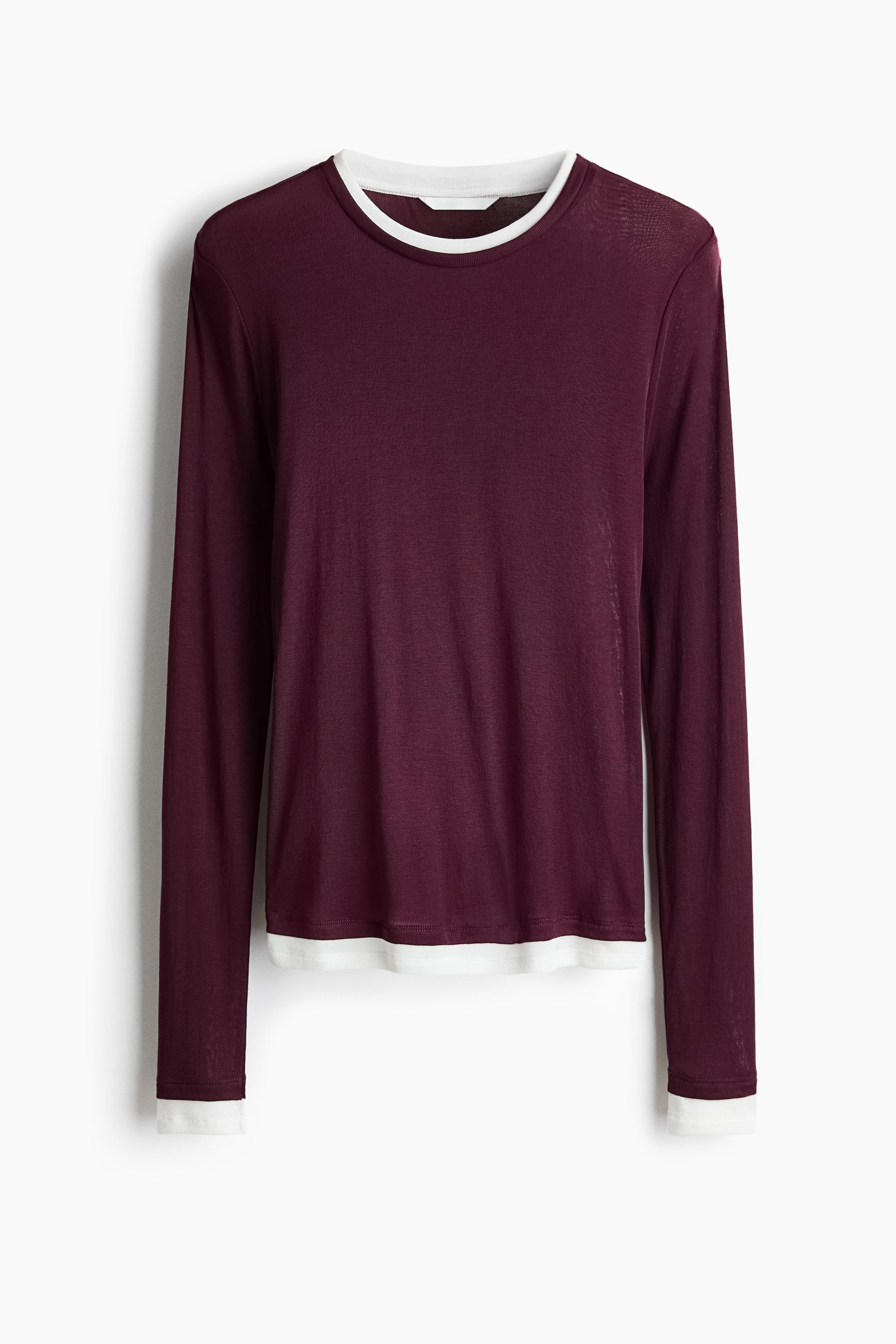 View larger image: A maroon long-sleeved top is displayed with a white layer visible at its round neckline, hem, and cuffs.