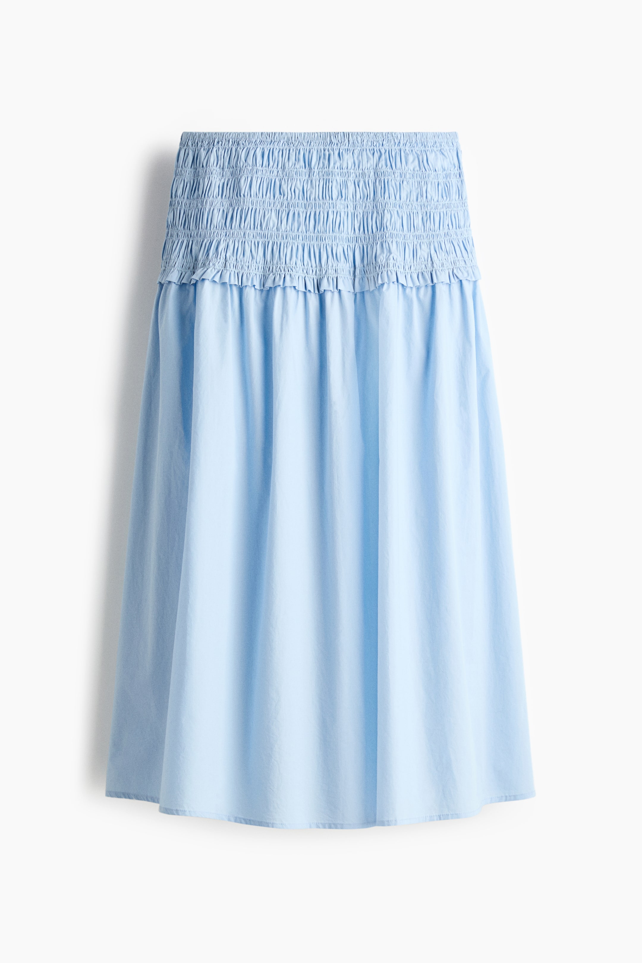 View larger image: A calf-length light blue skirt, crafted from a breezy cotton weave, showcases a broad, smocked waistband. A delicate frill trim accents just below the waistband, with the skirt gathering to offer enhanced volume.