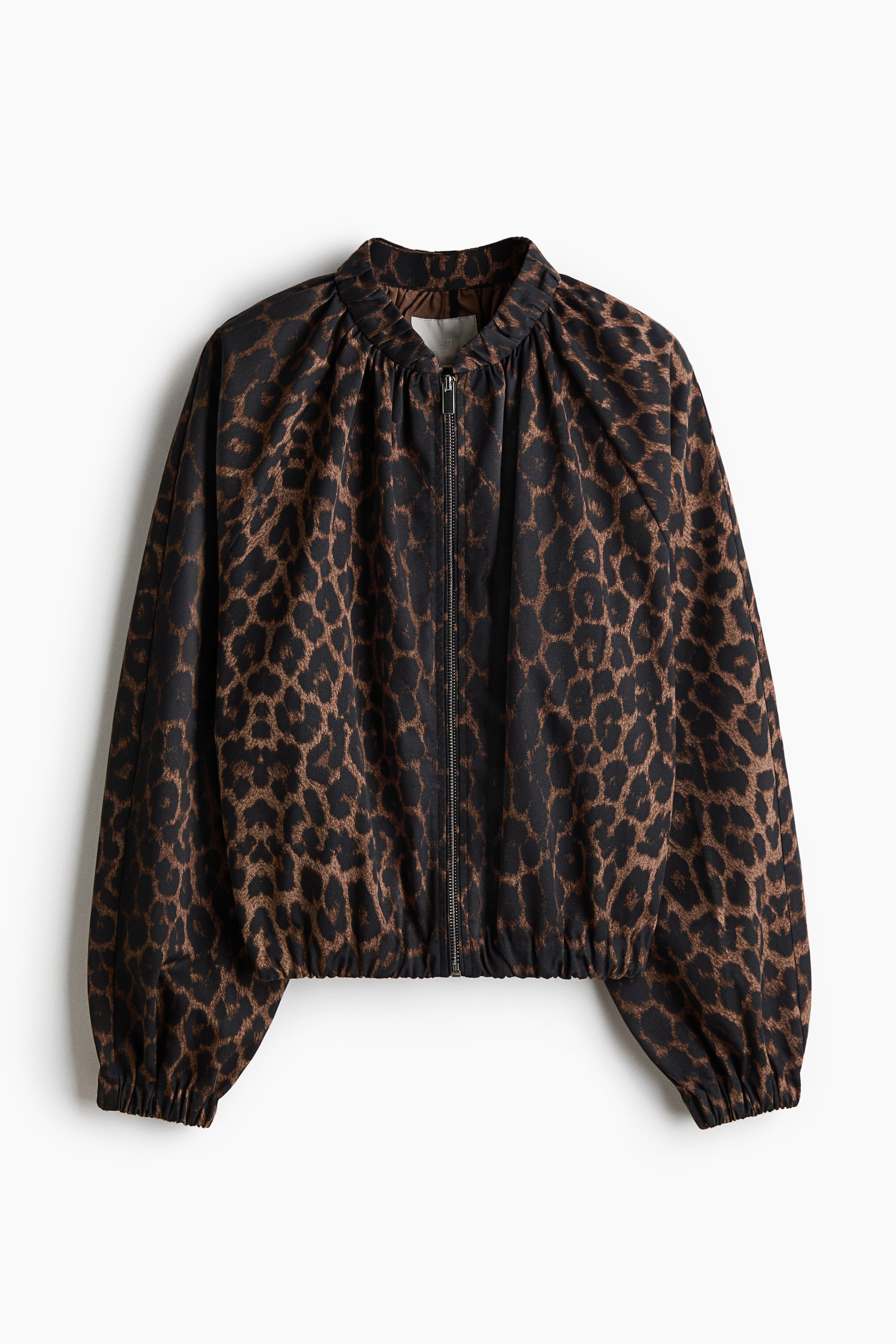 View larger image: A brown and black leopard print jacket is presenting its FRONT, featuring a full-length zipper closure. It is designed with a gathered stand-up collar, long sleeves gathering at elasticated cuffs, and an elasticated, gathered hem.