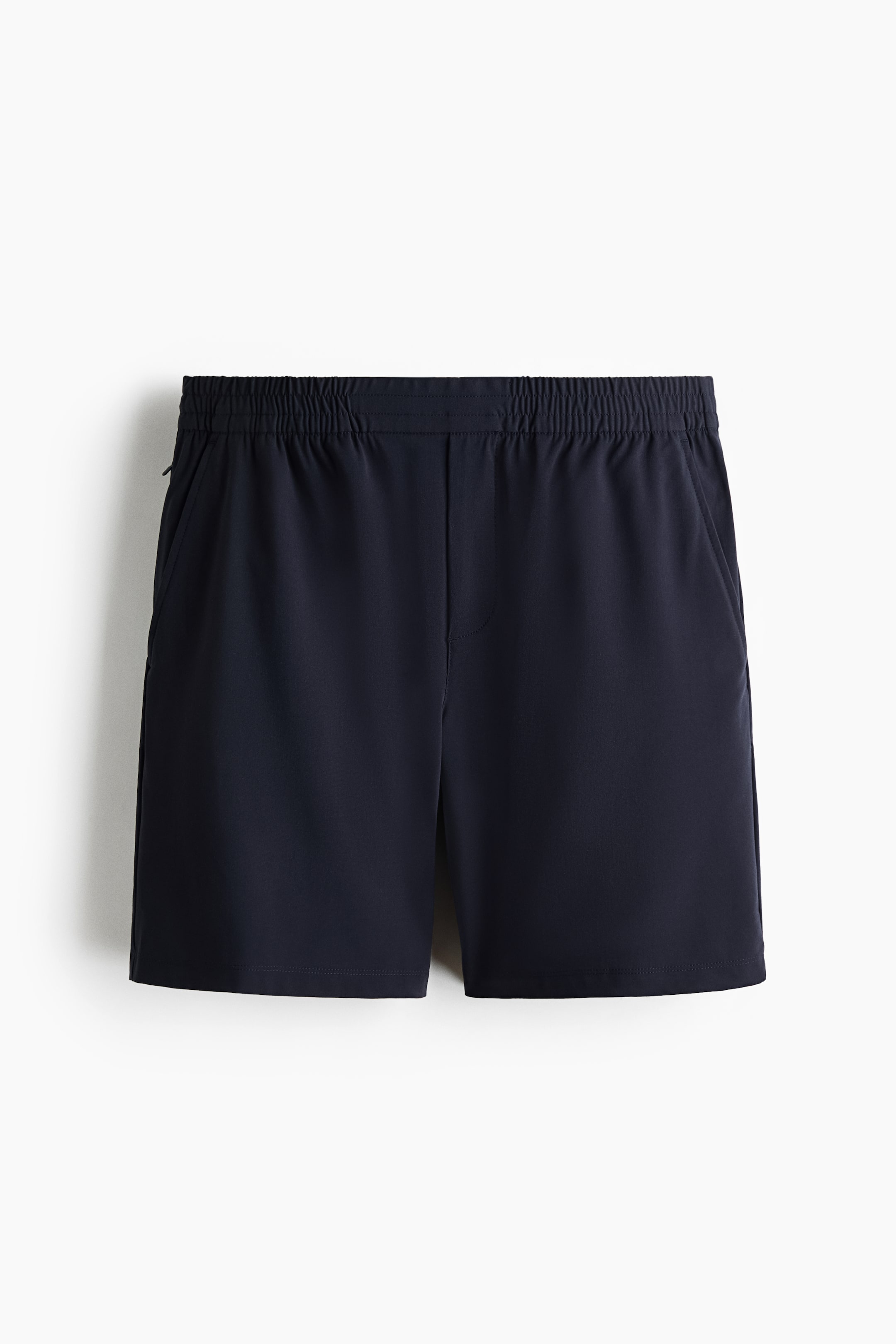 View larger image: Navy blue shorts are shown from the front, featuring an elasticized, ruched waistband, two open side pockets, and a small zippered pocket on the left side.