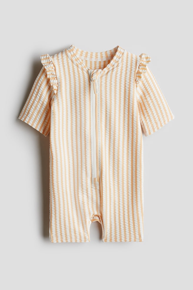 Swimsuit with UPF 50 - Peach/Striped/White/Seashells/White/Lemons/Light blue/Cherries/Cream/Strawberries/Light pink/Floral/Light beige/Hearts - 1