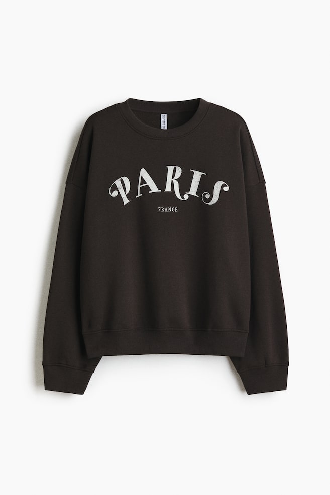 Sweatshirt mit Motiv - Dunkelgrau/Paris/Hellbeige/Hôtel de Luxe/Hellbeige/Wellness - 1