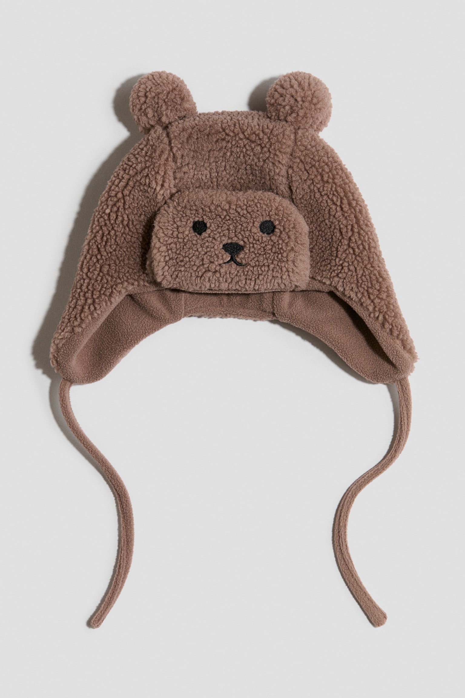 Fleecevuorinen teddykarvalakki - Ruskea