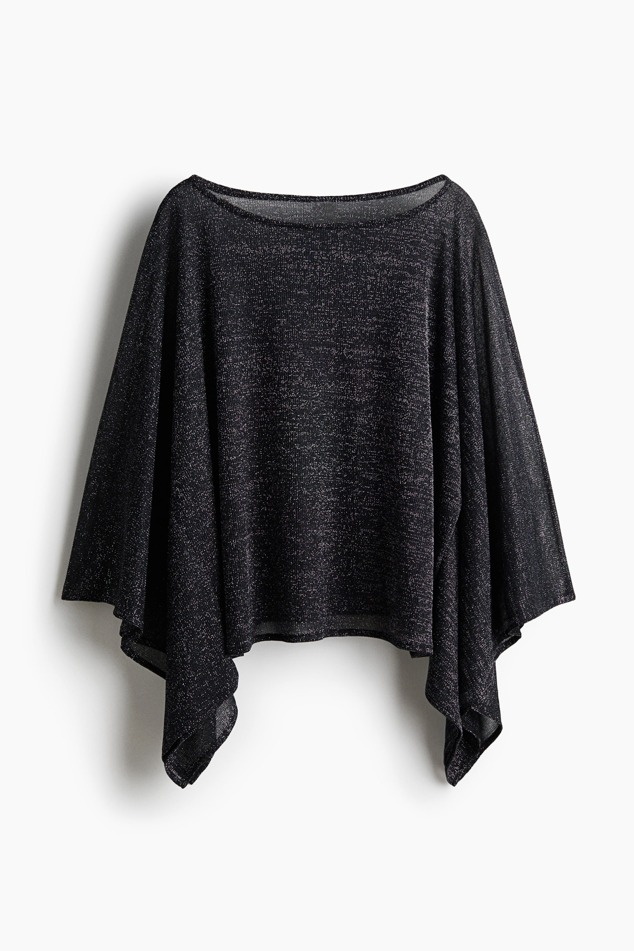 Voir une image plus grande: Un haut de style poncho en tricot métallique noir scintillant est suspendu et présenté de face, mettant en valeur un large col bateau et des manches drapées façon cape. Le tissu léger et semi-transparent tombe en cascade pour former un ourlet asymétrique en pointe de mouchoir des deux côtés.