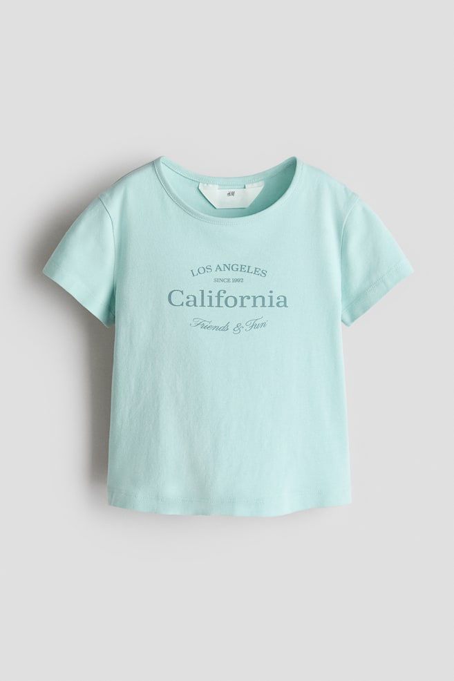 Bawełniany T-shirt z nadrukiem - Jasnoturkusowy/California/Jasnoróżowy/Kwiaty - 1