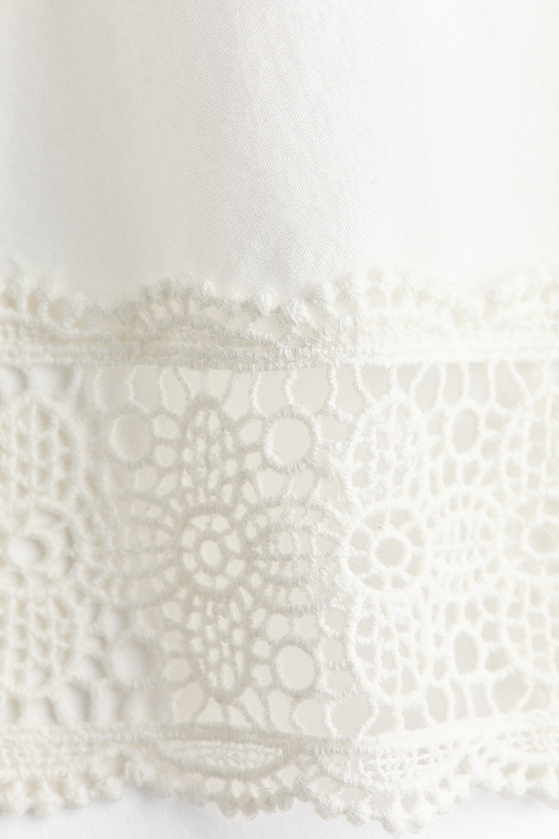 Lace-trimmed one-shoulder top