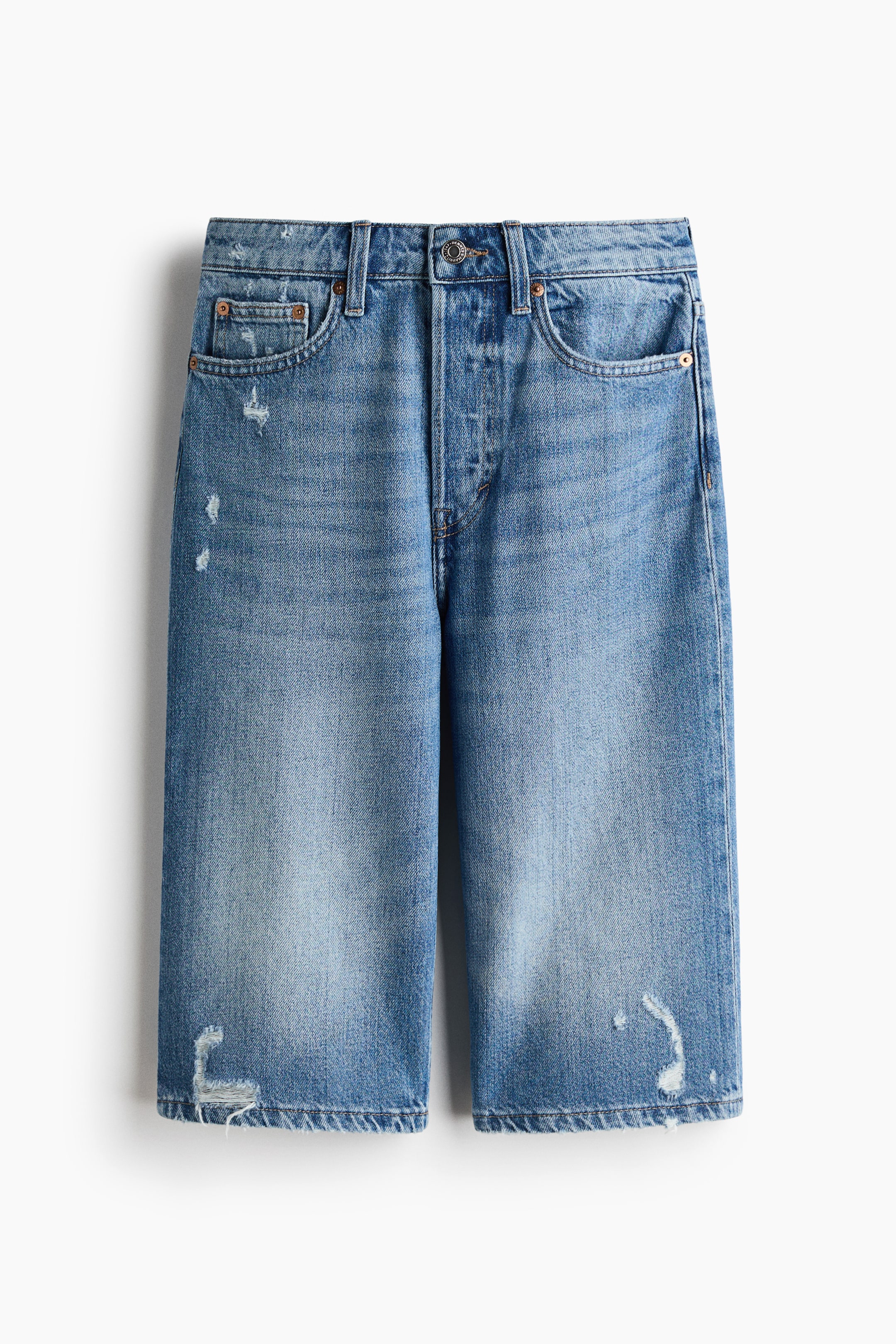 View larger image: Denim shorts hang facing forward, showcasing a light blue wash with distressing and fading. They feature a button fly, belt loops, front pockets, and frayed hems.