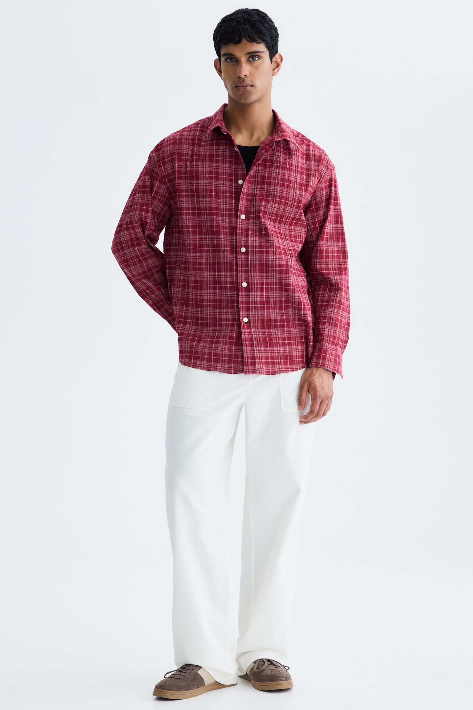 A red checked shirt is facing directly forward, featuring a standard collar and a button-up front with white buttons. Thin white and light brown lines are forming the checked pattern. - 1