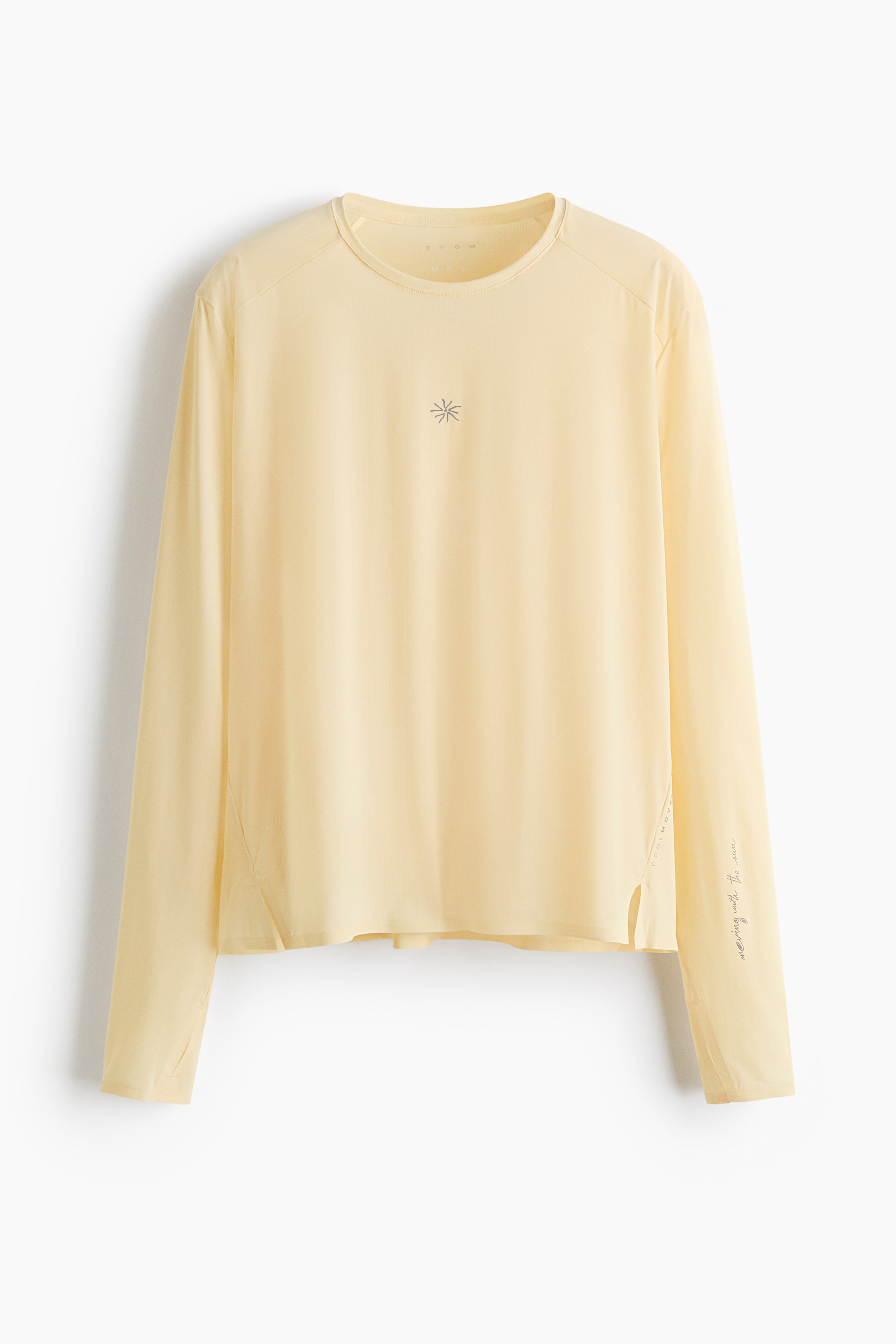 View larger image: A pale yellow long-sleeved crew neck shirt is showcasing its front, featuring raglan sleeves, a subtle vertical textured pattern, and a small star-like emblem centered on the chest. The right side seam displays "COOLMAX" vertically, while "moving with the sun." is printed on the left sleeve, with small side slits completing the bottom hem.