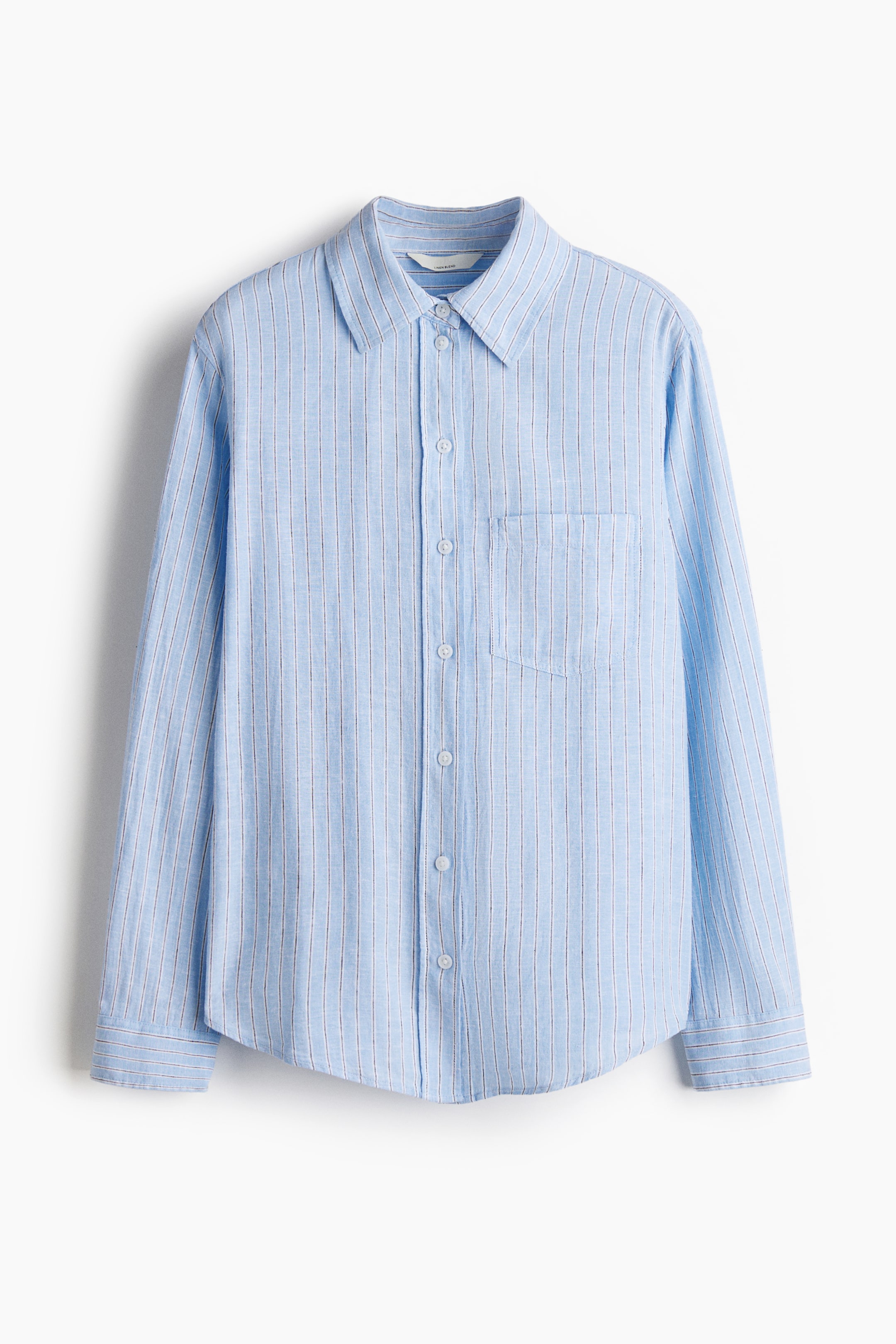 View larger image: A light blue shirt in an airy weave is shown from the front, featuring subtle vertical stripes, a collar and buttons down the front. It shows an open chest pocket, long sleeves with buttoned cuffs and a rounded hem.