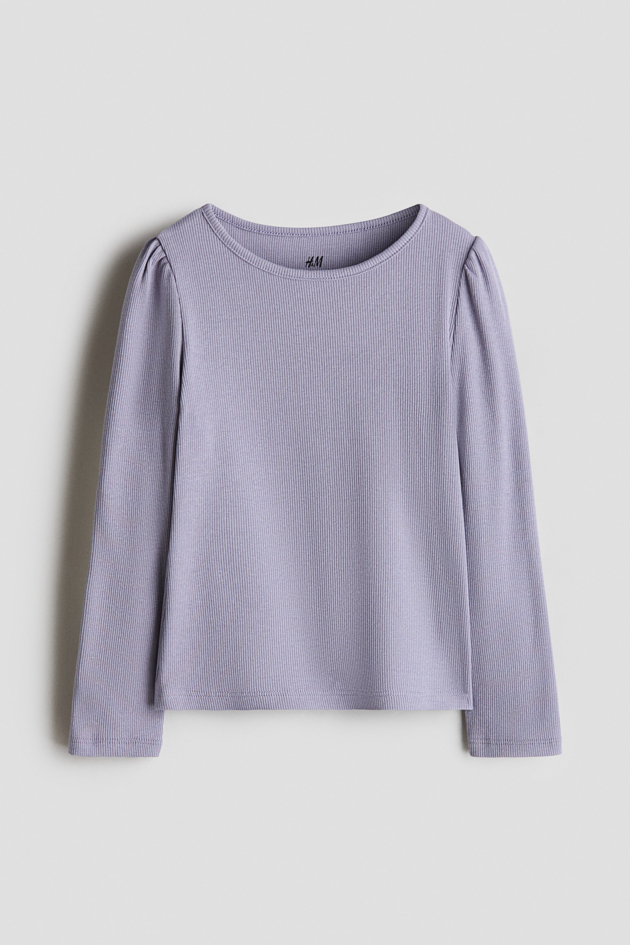 View larger image: A lavender ribbed long-sleeved top is laid flat, featuring a round neckline and subtle puffed sleeves.