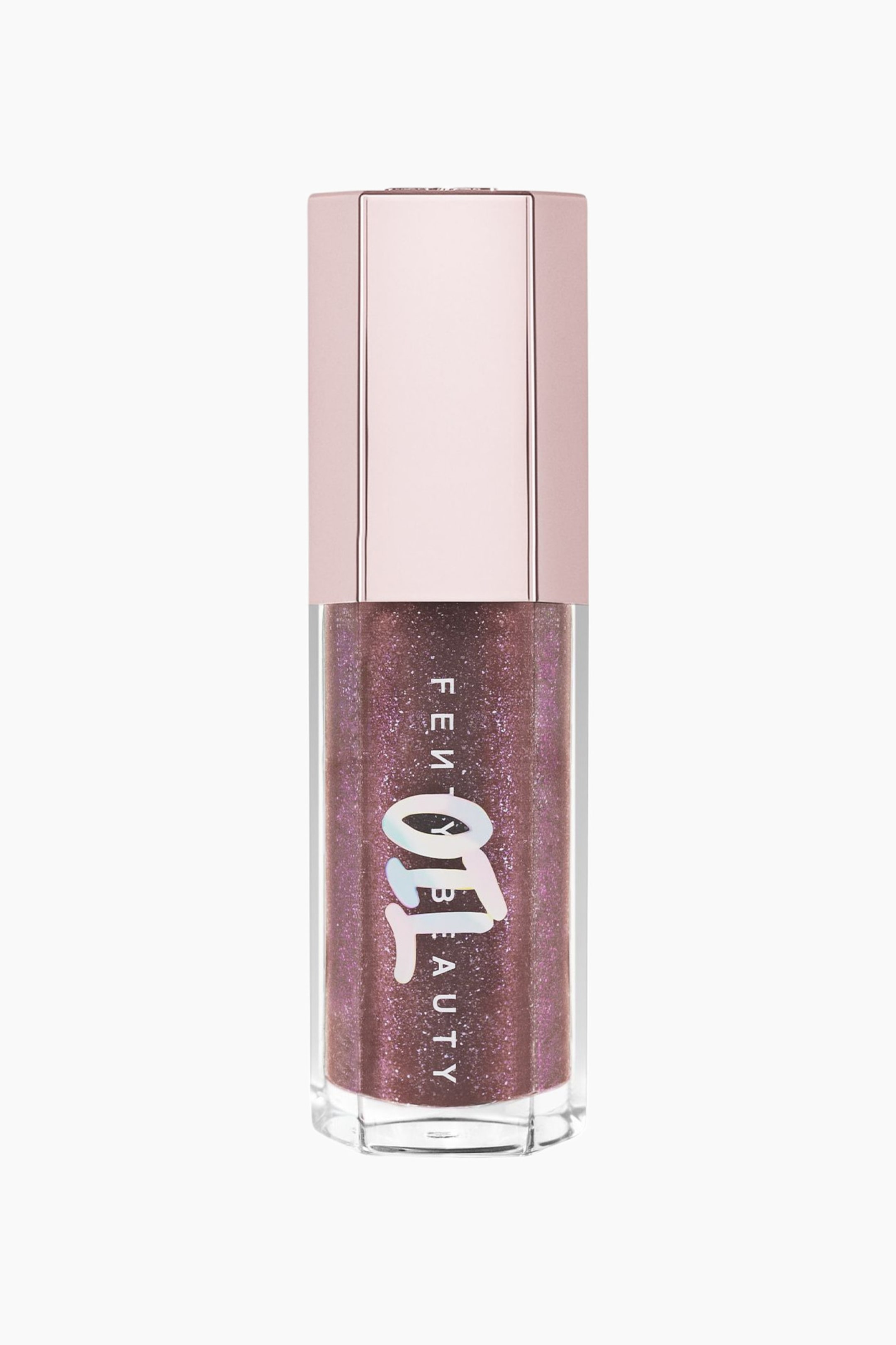 Visa större bild: Gloss Bomb Oil Luminizing Lip Oil 'n Gloss står upprätt och visar upp en klar hexagonal flaska fylld med en skimrande, glittrig mauve-plommonfärgad vätska. Förpackningen har en metallisk ljusrosa hexagonal kork och visar vertikal vit branding överlagrad med en stiliserad holografisk "OIL"-grafik.