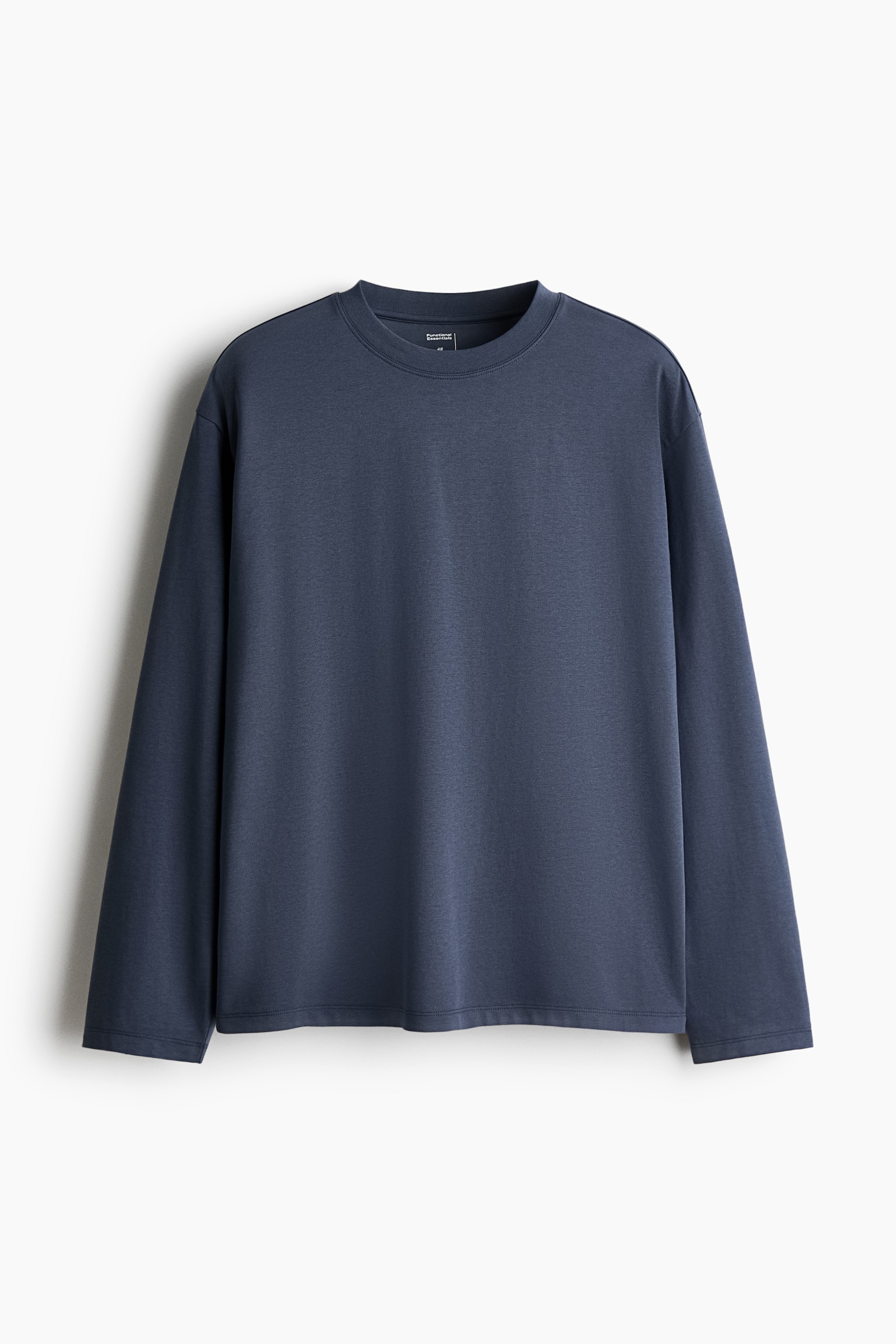 A slate blue, long-sleeved tee is shown from the front, featuring a relaxed fit, a ribbed crew neckline, dropped shoulders, and a straight-cut hem. - 1