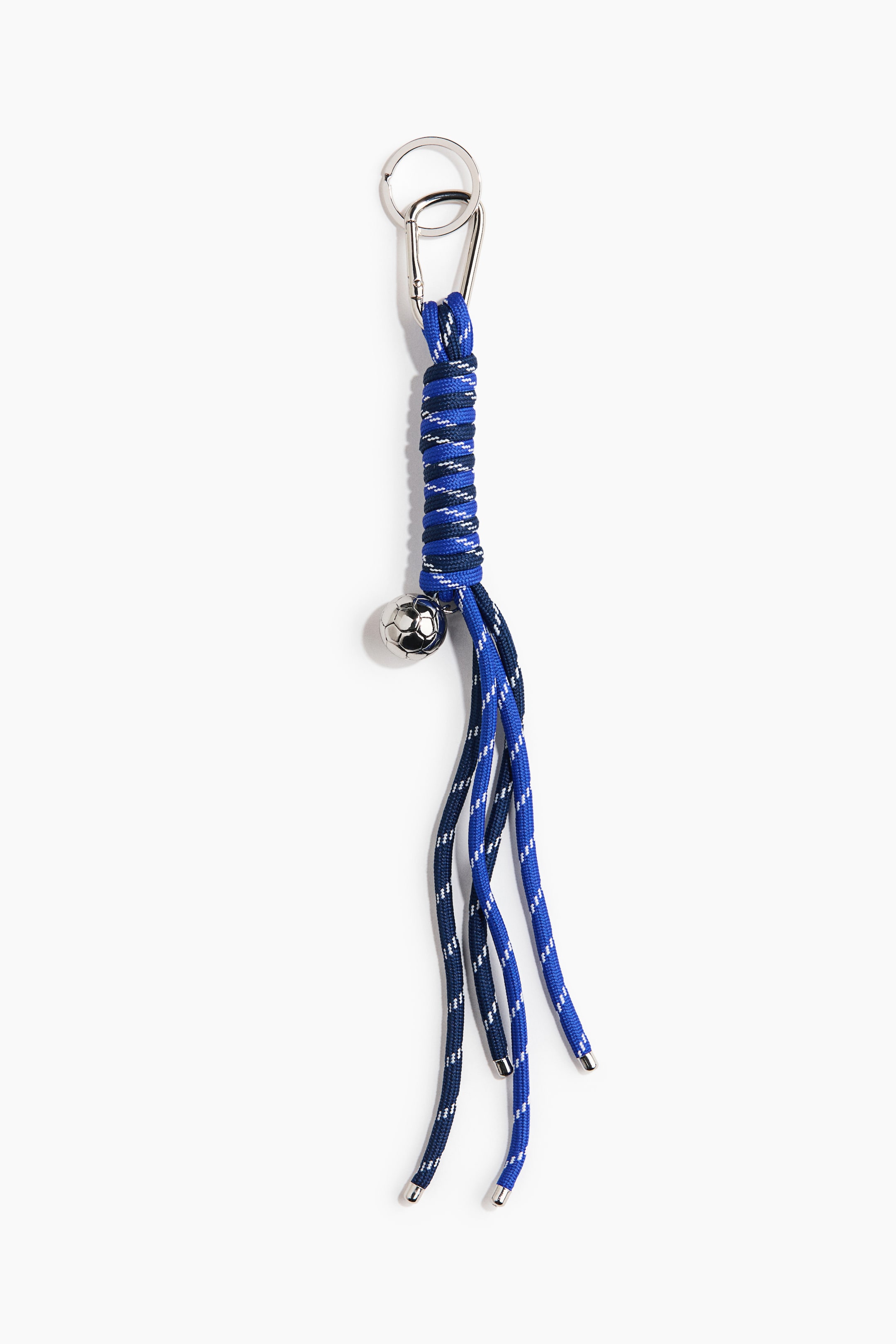 View larger image: This keychain features a silver-toned key ring and a carabiner clip at its top, with a thick royal blue speckled cord forming the main body. A darker blue speckled cord is wrapped around its upper section, from which a silver-toned soccer ball charm dangles. Multiple royal blue and navy blue speckled cord strands extend downward, each ending with a silver-toned metal cap.