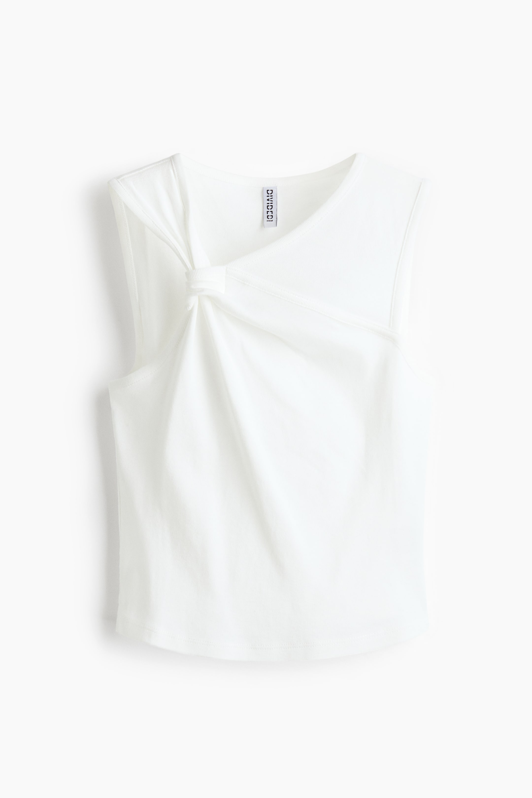 View larger image: A white sleeveless top is showcasing a front view, featuring an asymmetrical neckline with a prominent knot detail on the left shoulder, creating soft drapes across the front.
