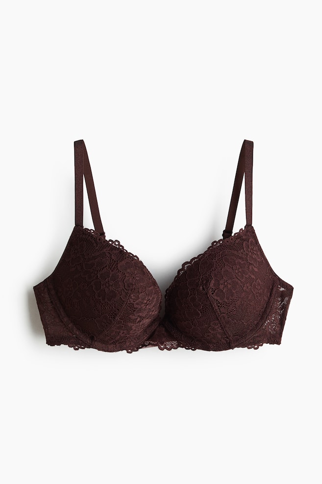 A front-facing dark brown super push-up bra showcases intricate lace detailing on its thickly padded, underwired cups and adjustable shoulder straps. - 1