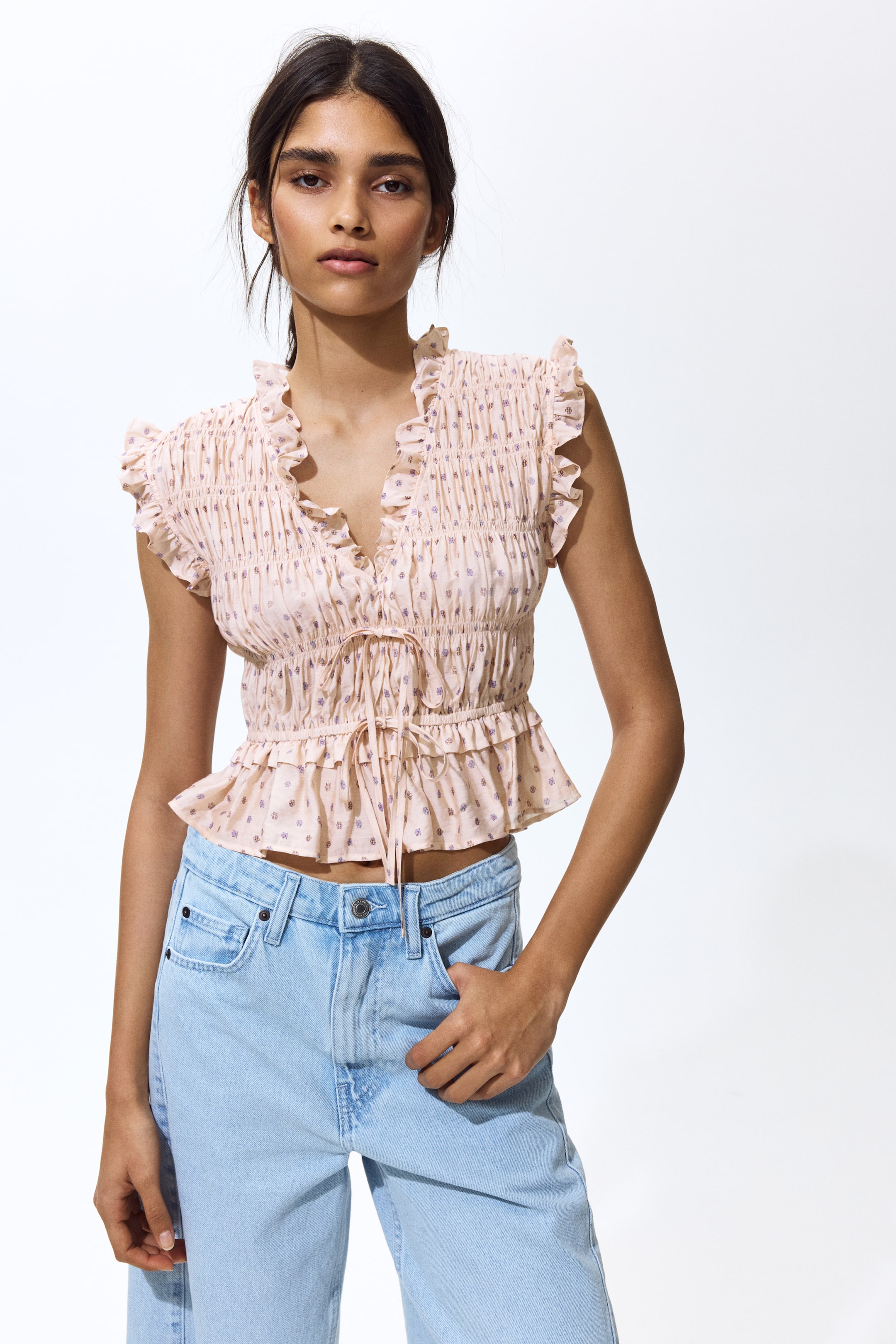 Sleeveless smocked blouse