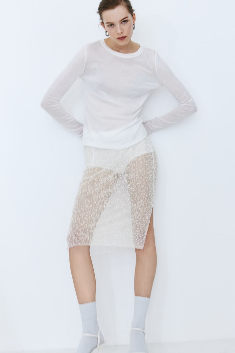 H&M Calf-length skirt in mesh embellished with plastic beads and sequins. Narrow elastication at the waist and a concealed zip at one side. Straight-cut hem with a slit at each side. Short jersey underskirt.