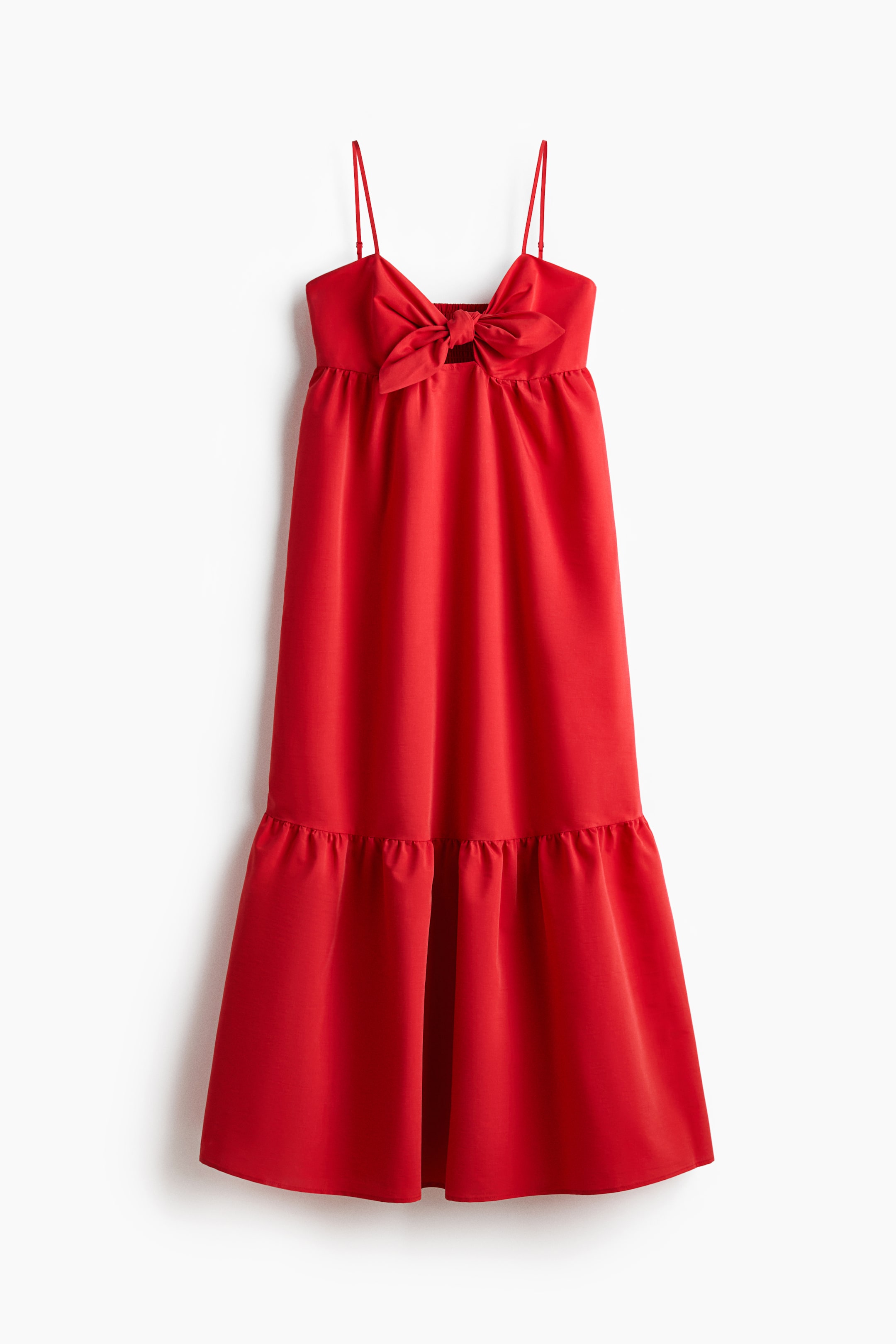 Ver imagen más grande: Un vestido midi rojo se muestra de frente, con un escote corazón y finos tirantes ajustables. Presenta un ajuste ceñido sobre el busto con un detalle de lazo y una sección recortada en el frente, una costura fruncida debajo y una falda acampanada con un volante fruncido sobre el dobladillo.