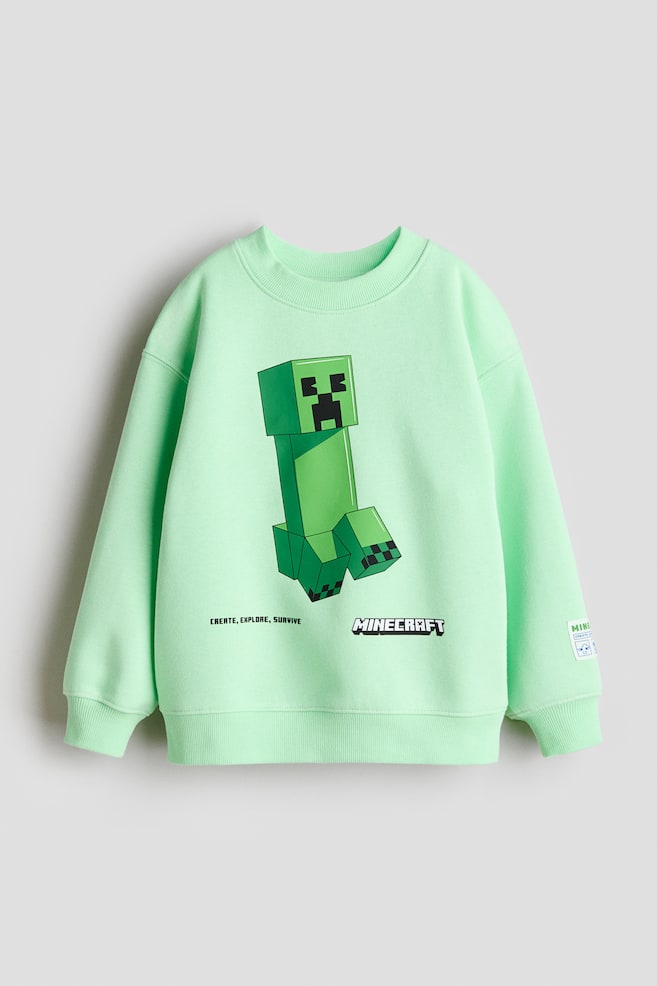 Sweatshirt mit Print - Hellgrün/Minecraft/Blau/Micky Maus/Weiß/Marvel Comics/Weiß/Minecraft/Beige/Jurassic World/Cremefarben/TMNT/Marineblau/Pokémon/Blau/Bluey/Cremefarben/Autos/Weiß/DC Comics - 1