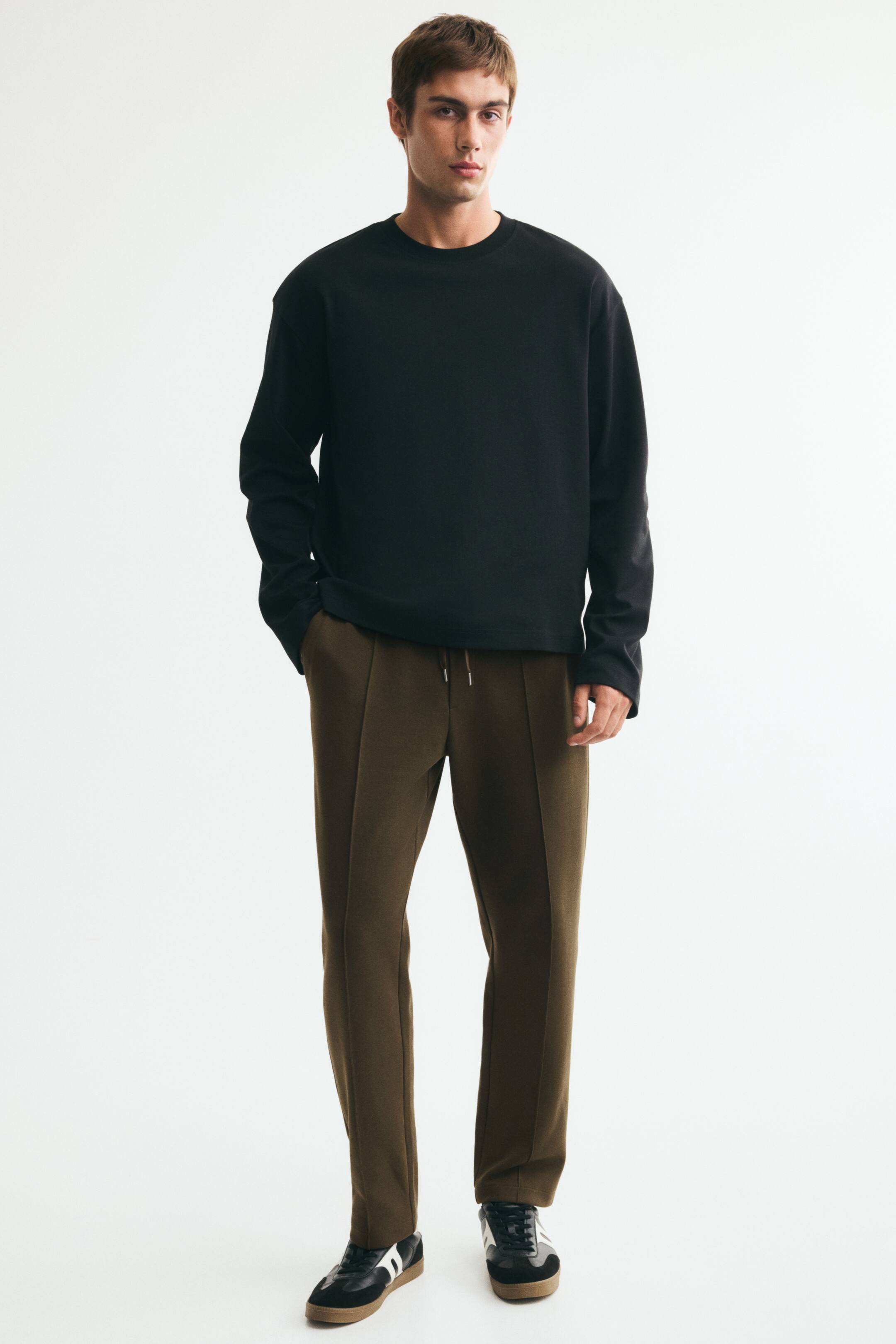 View larger image: Regular Fit Interlock crease-front joggers - Dark khaki green - Men | H&M IE 1