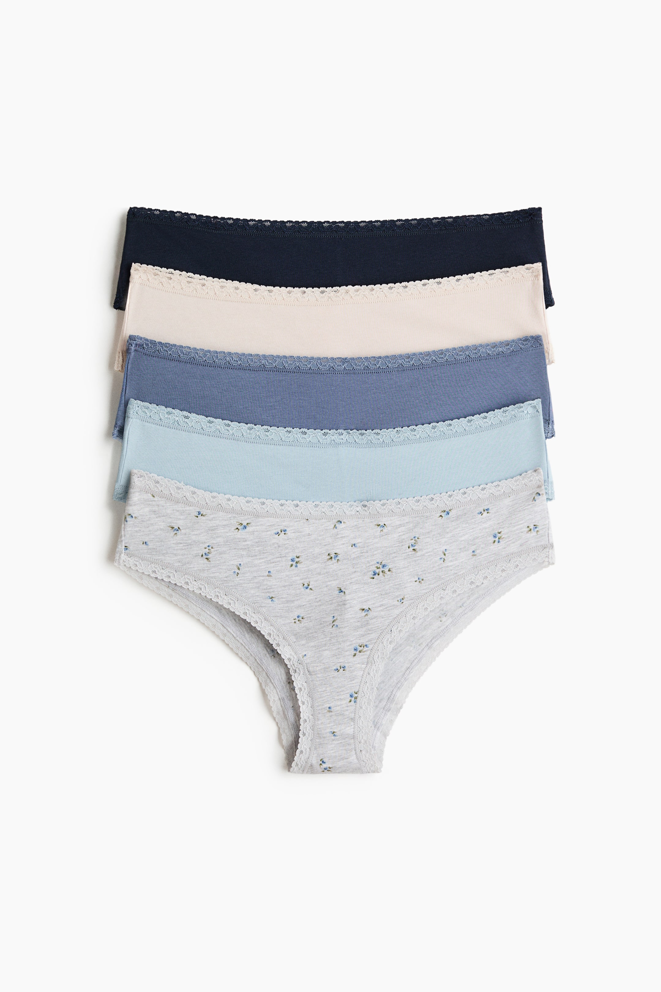 View larger image: A stack of five cotton jersey mid-rise briefs is laid flat, each featuring narrow lace trims along the waist and leg openings, and shown in solid navy, light beige, dusty blue, light blue, and a gray brief with a blue floral pattern.