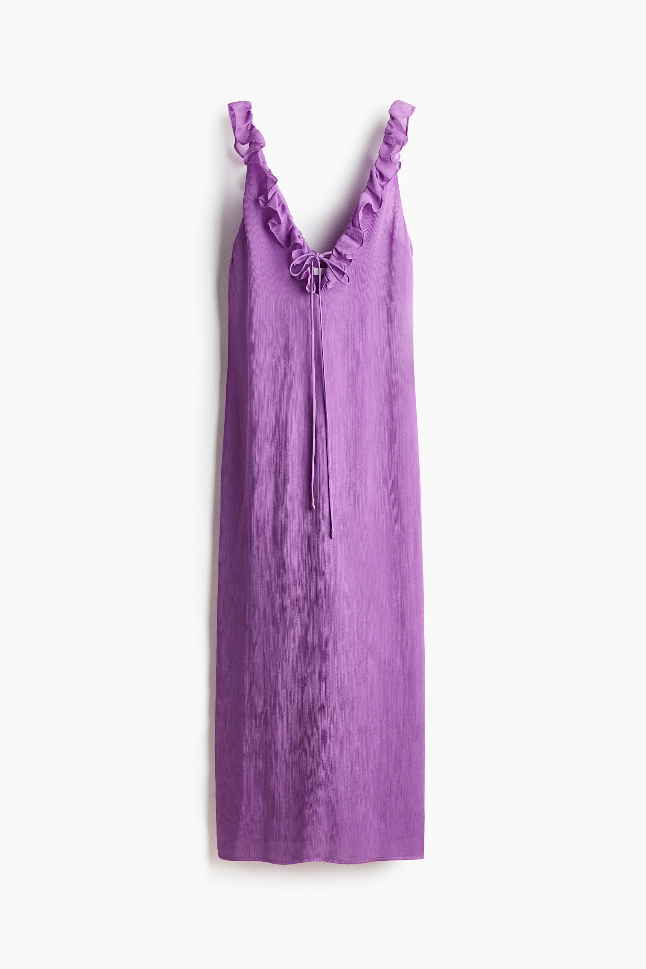 View larger image: A purple midi slip dress showcases a ruffled V-neckline and ruffled shoulder straps. A tie-front detail with slender cords is visible at the center of the V-neck, with the cords elegantly hanging down the front.