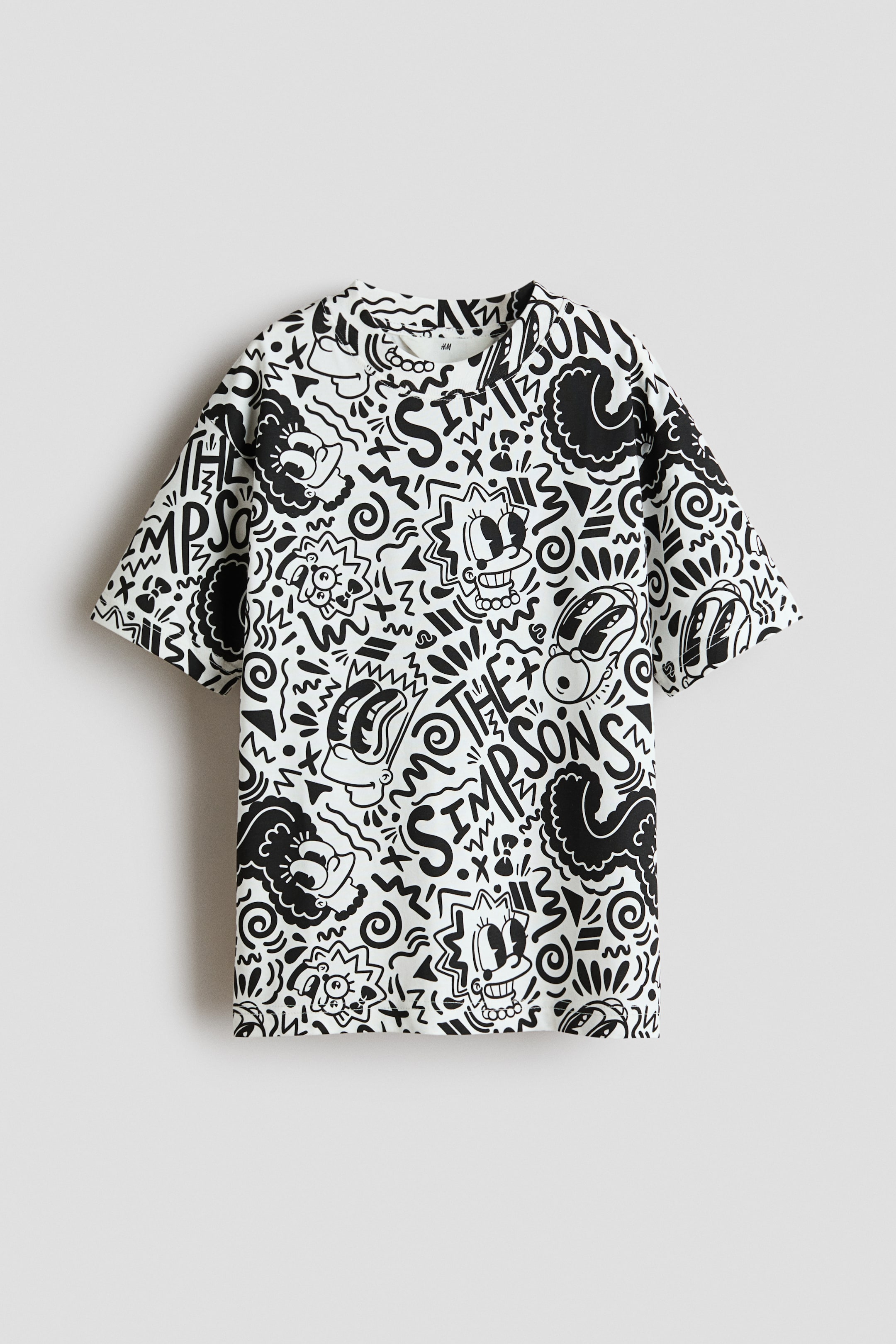 View larger image: "This T-shirt showcases a black and white doodle pattern on soft cotton jersey, featuring characters from The Simpsons and abstract shapes. It includes a ribbed trim around the neckline, offering a relaxed fit with dropped shoulders."