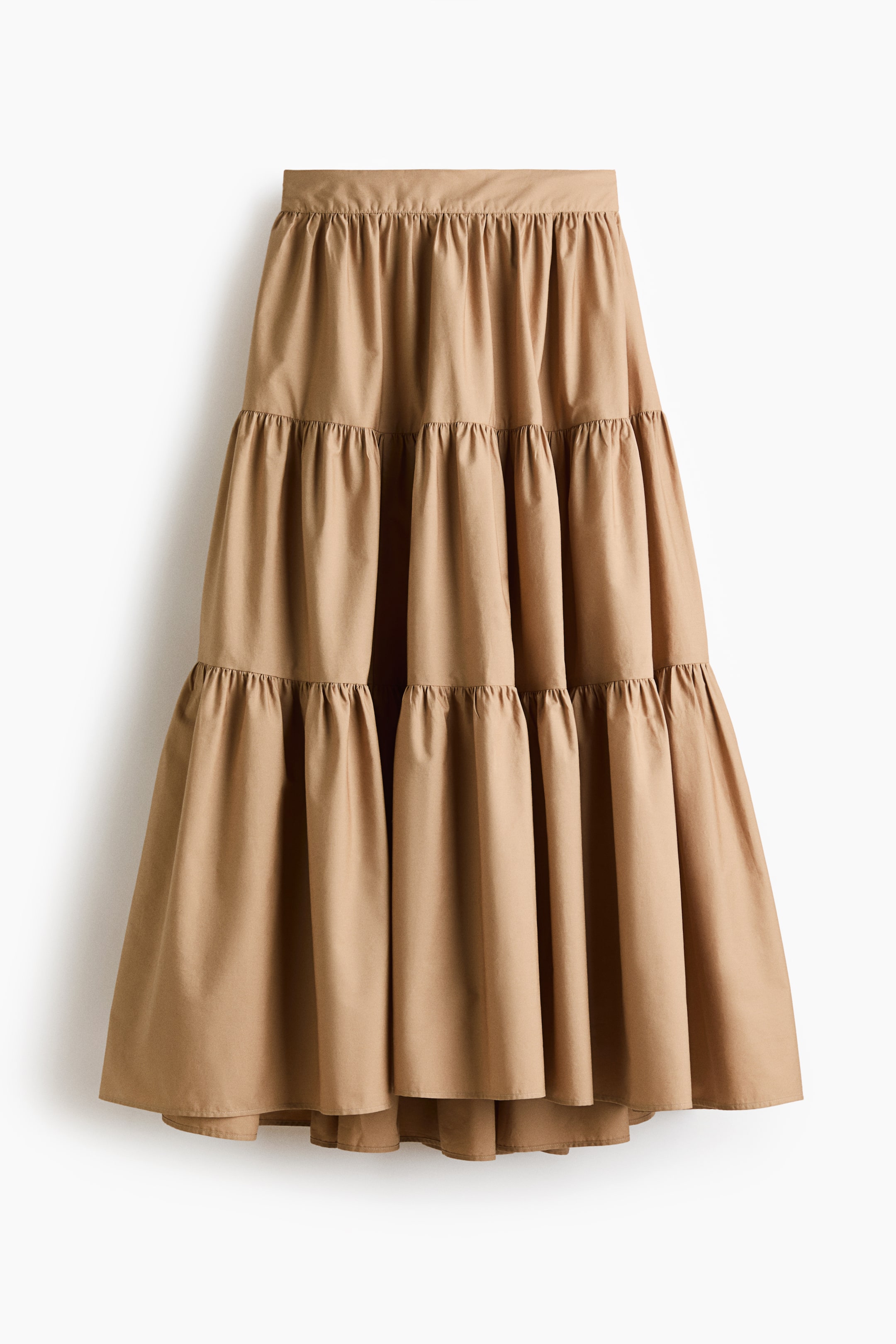 View larger image: A tan tiered skirt is shown from the front, featuring a gathered waistband and multiple gathered tiers.
