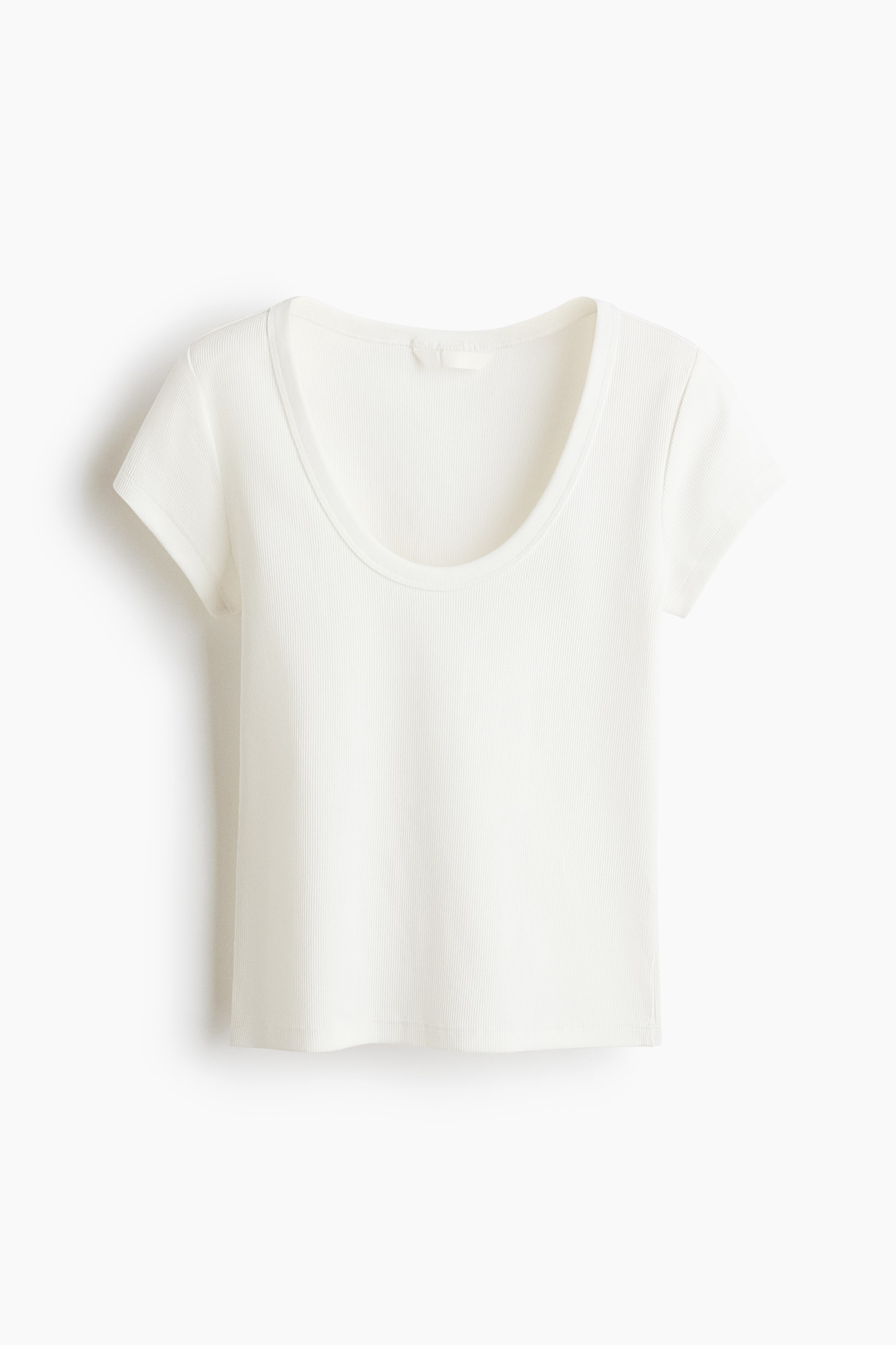 View larger image: A cream fitted t-shirt crafted from ribbed cotton jersey showcases its front, featuring a scoop neckline, short sleeves, and a straight hem.