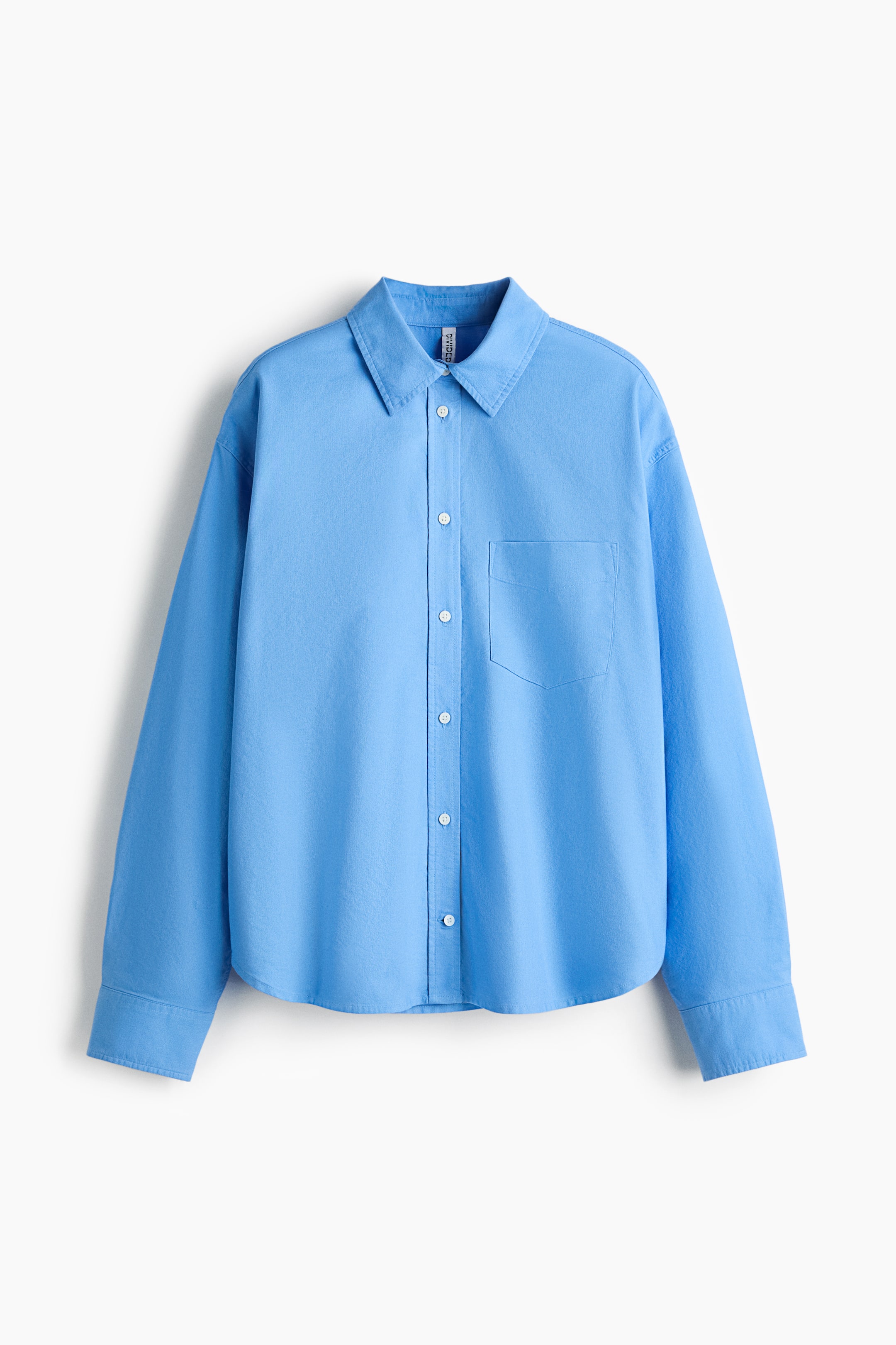 View larger image: A light blue shirt is displaying its front, featuring a pointed collar, a full button placket with white buttons, a single patch pocket on the left chest, and long sleeves with buttoned cuffs.