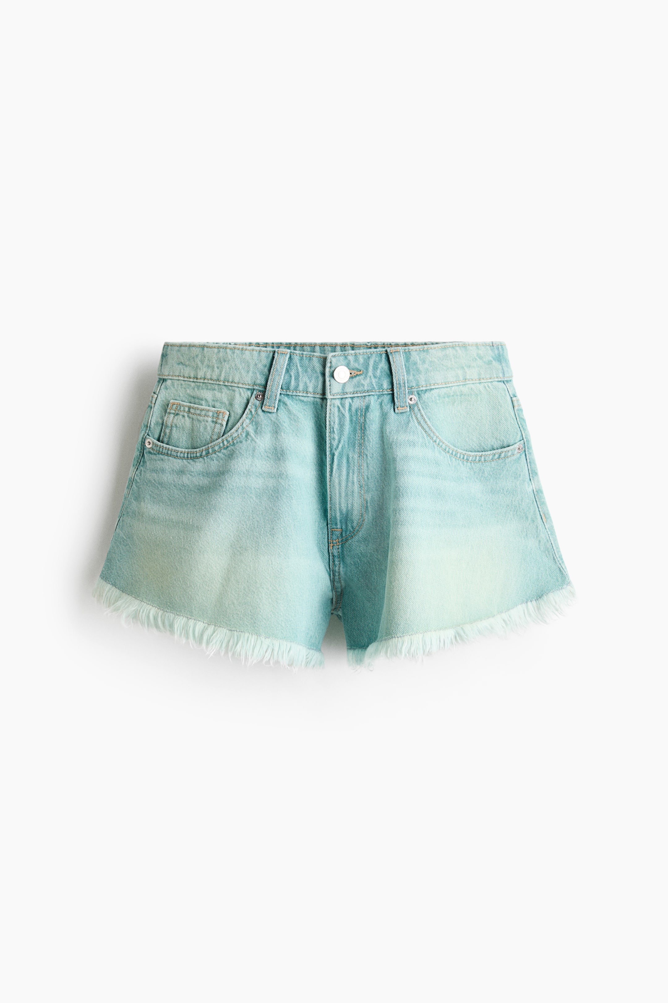 View larger image: Light blue denim shorts are on show from the front, showcasing a washed-out finish and a frayed hem. They include a single white button closure, belt loops, and classic front pockets.