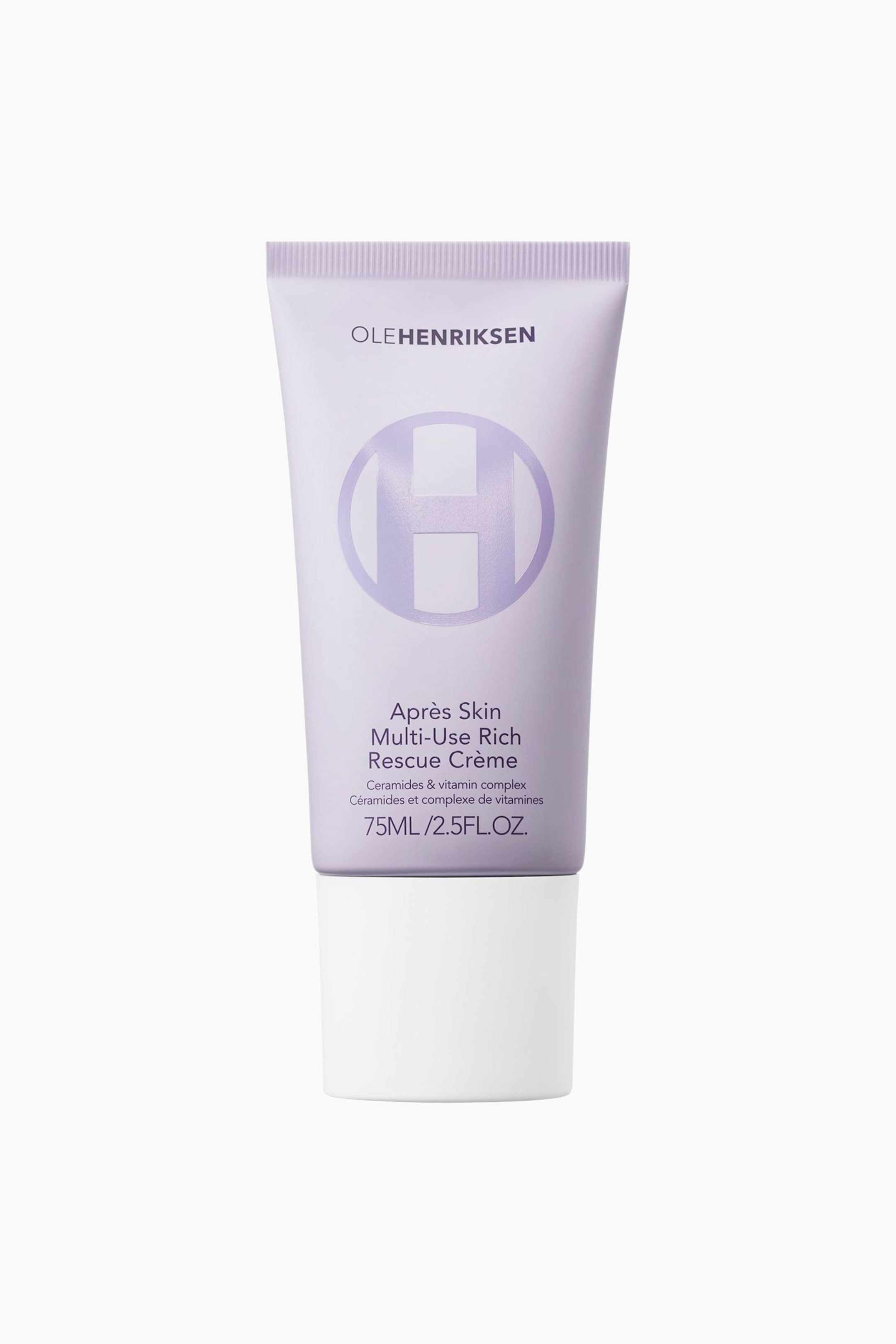 Se større billede: En Ole Henriksen Aprés Skin Multi-Use Rich Rescue Crème står oprejst og vender fremad. Den lyse lilla squeeze-tube har brandnavnet, et stort "H"-logo i en cirkel, produktnavnet og volumenoplysninger på forsiden og er forsynet med en hvid bund.