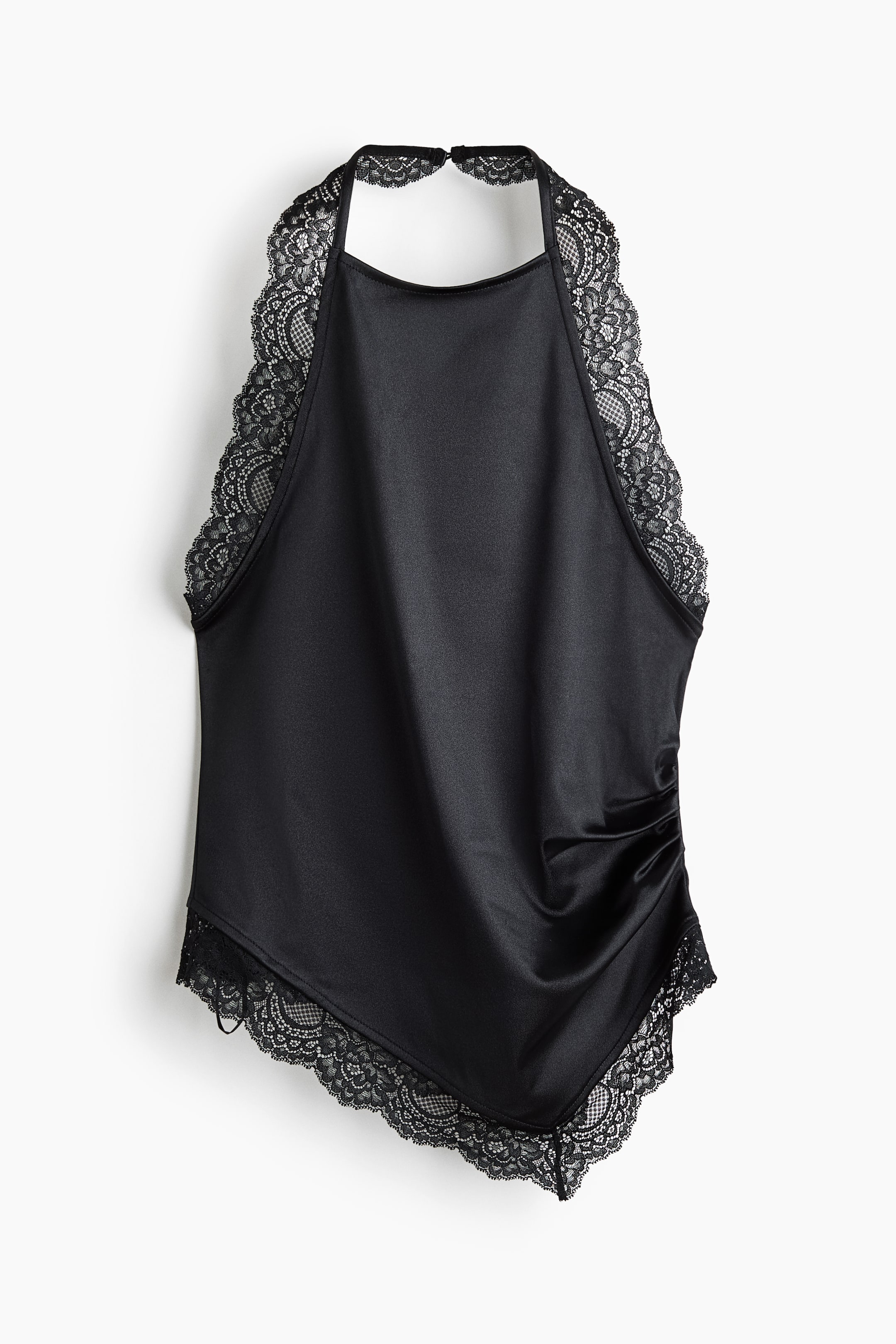 View larger image: A black satin halter top is shown from the front, featuring a high neckline bordered by wide, scalloped lace trim along the armholes and neck strap. The top shows side ruching that creates a draped effect, finishing in an asymmetrical, pointed hemline adorned with matching scalloped lace.