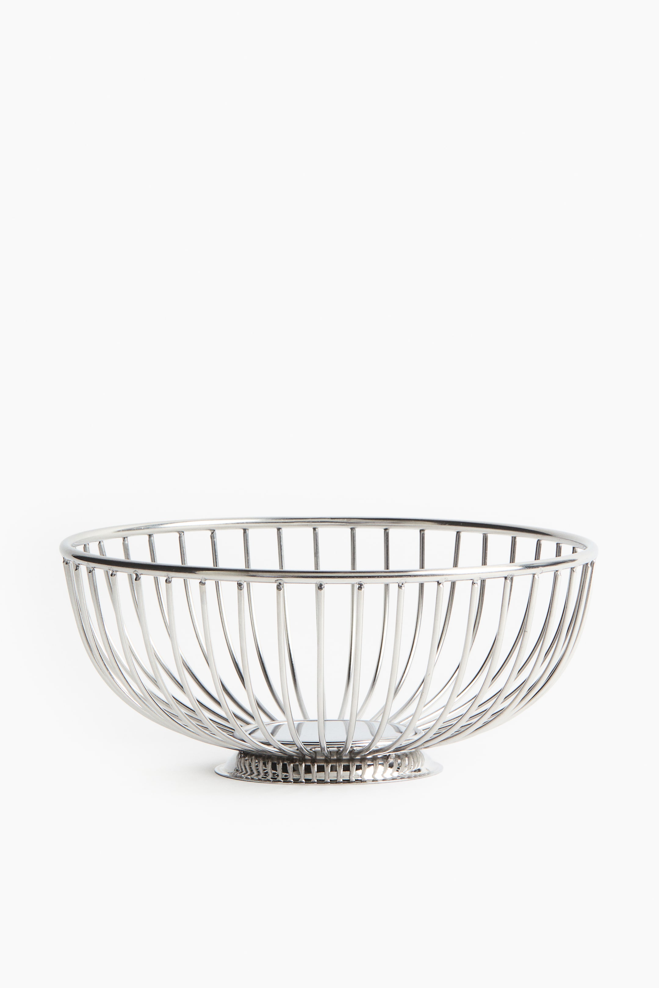 View larger image: A silver-toned metal wire bowl features an open, rounded top. Its body forms a curved, open-work design with evenly spaced vertical wires, resting on a circular, textured base.