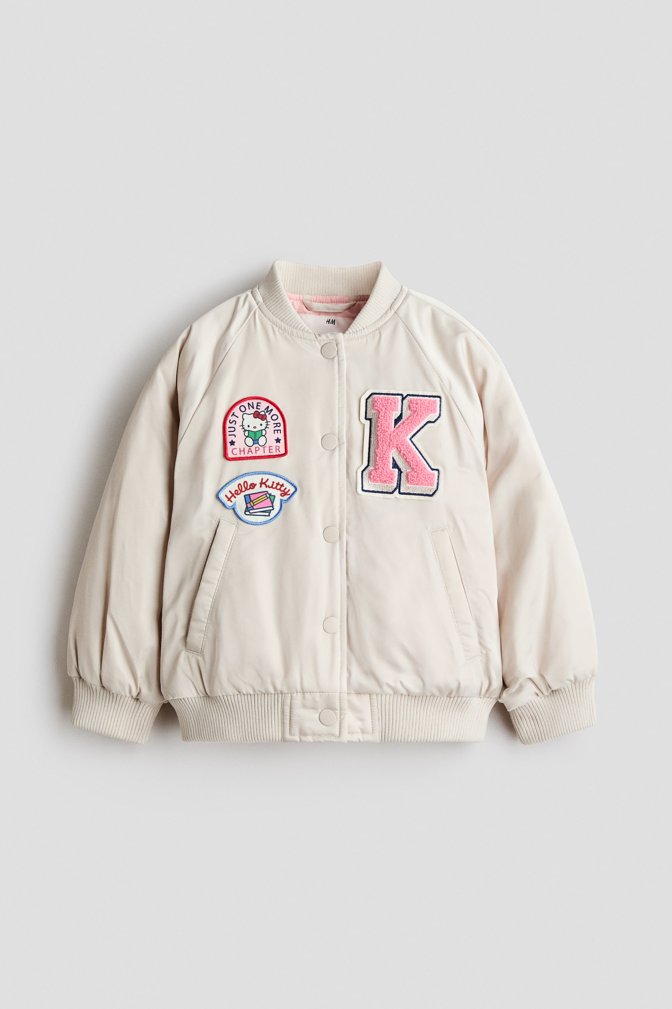 View larger image: Padded patch-detail baseball jacket - Light beige/Sanrio - Kids | H&M 1