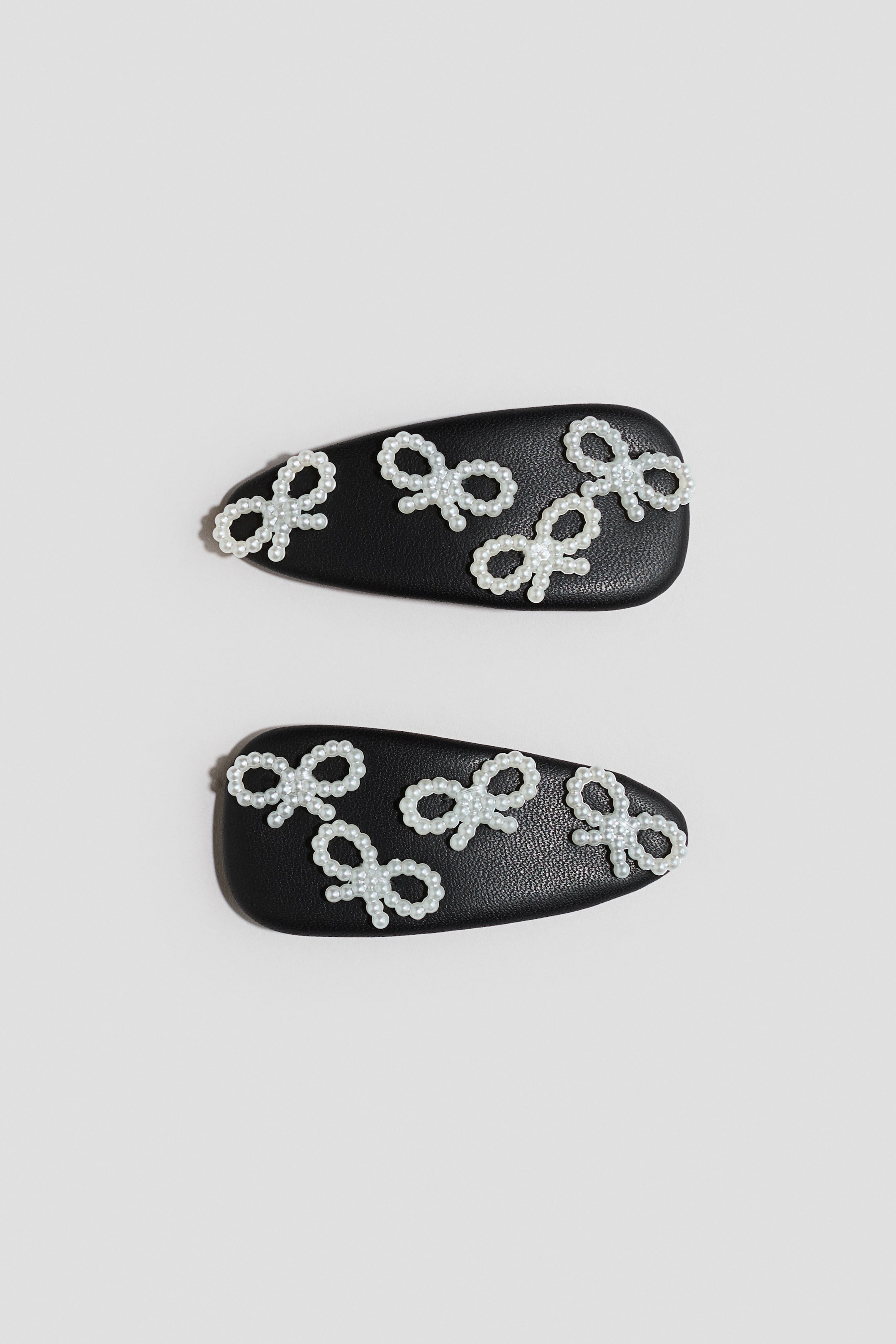 Ampliar la imagen: 2-pack Broches para el cabello con pedrería - Negro/Moños - Kids | H&M MX 2