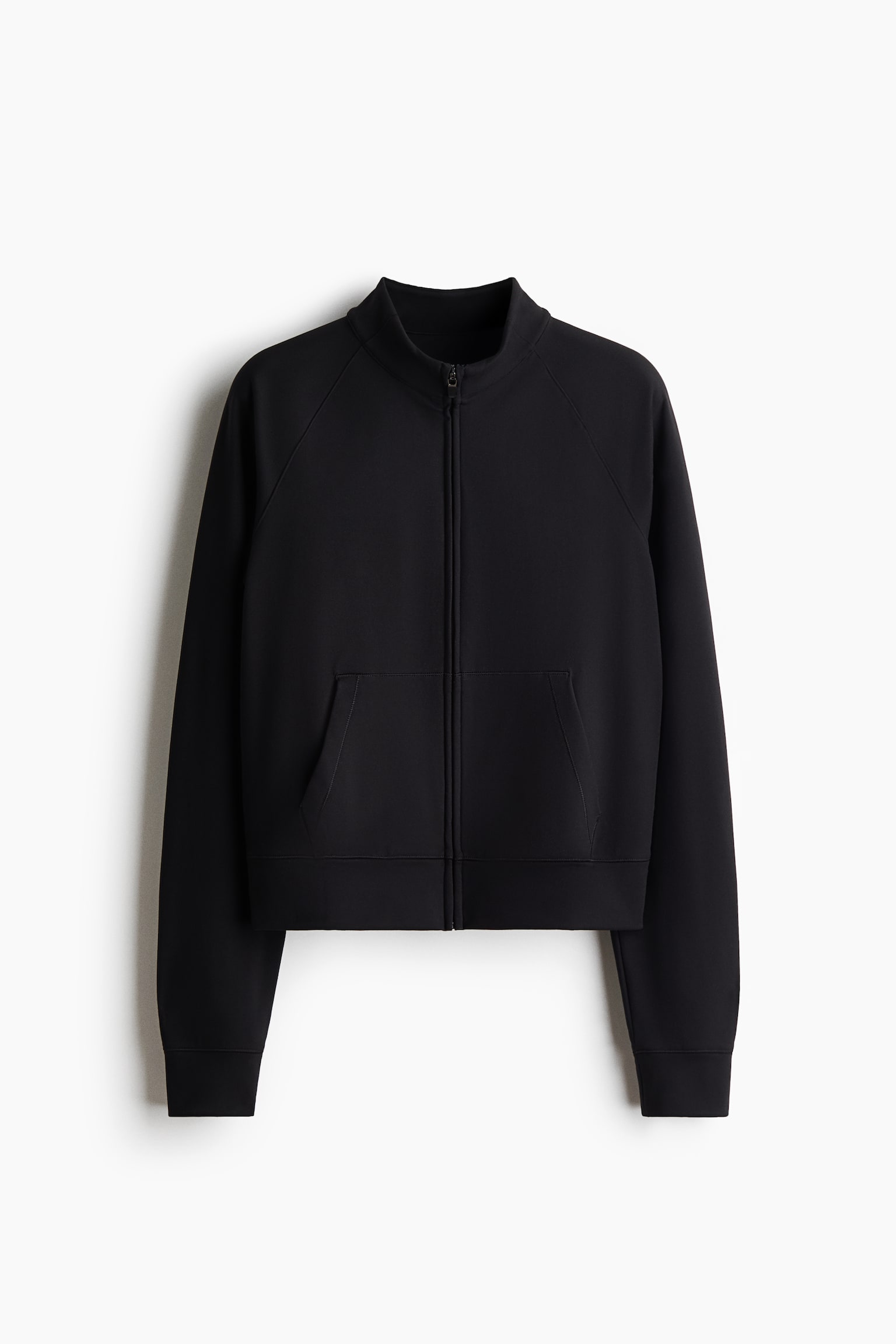 A black zip-up sweatshirt is shown from the front, featuring a high mock collar, a full-length front zipper, and long raglan sleeves with ribbed cuffs. The sweatshirt showcases a split kangaroo pocket and a ribbed hem.