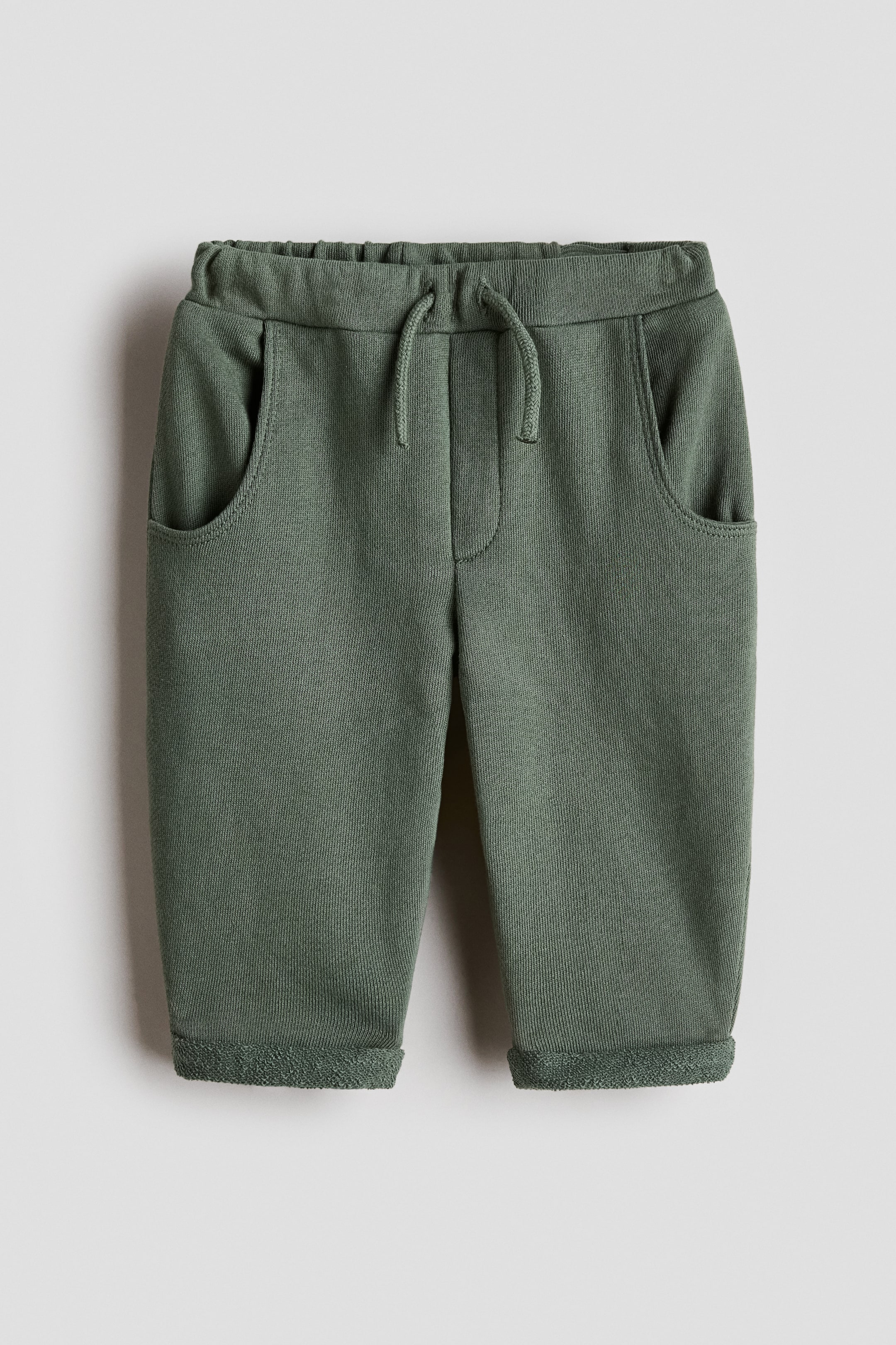 Visualizza immagine più grande: Joggers in felpa - Verde scuro - BAMBINO | H&M IT 1