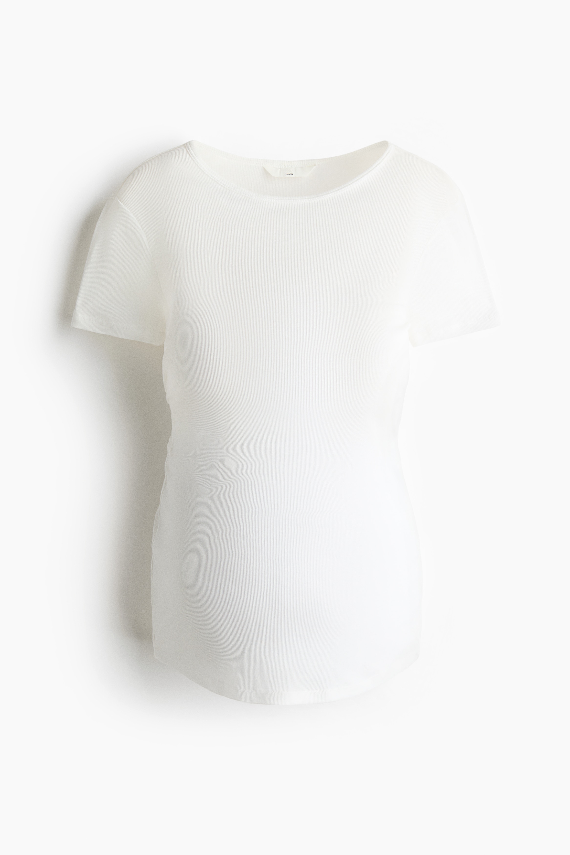 A white, fitted ribbed-knit T-shirt with a round neckline and short sleeves is worn by the model, stretching over their pregnant stomach. The T-shirt is styled with light-wash blue jeans.