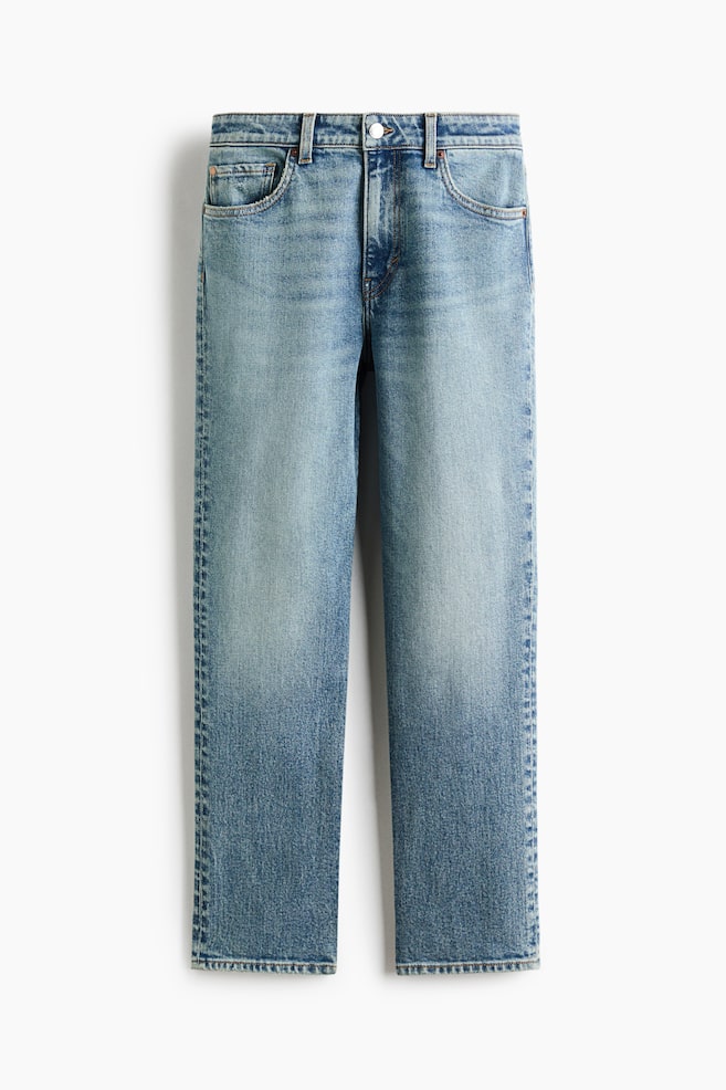 A pair of high-waisted, straight-leg jeans is shown in a front-facing view, featuring a light-to-medium blue wash with subtle fading along the thighs. The jeans are displaying a classic five-pocket design, belt loops, and a single button closure at the waist. - 1
