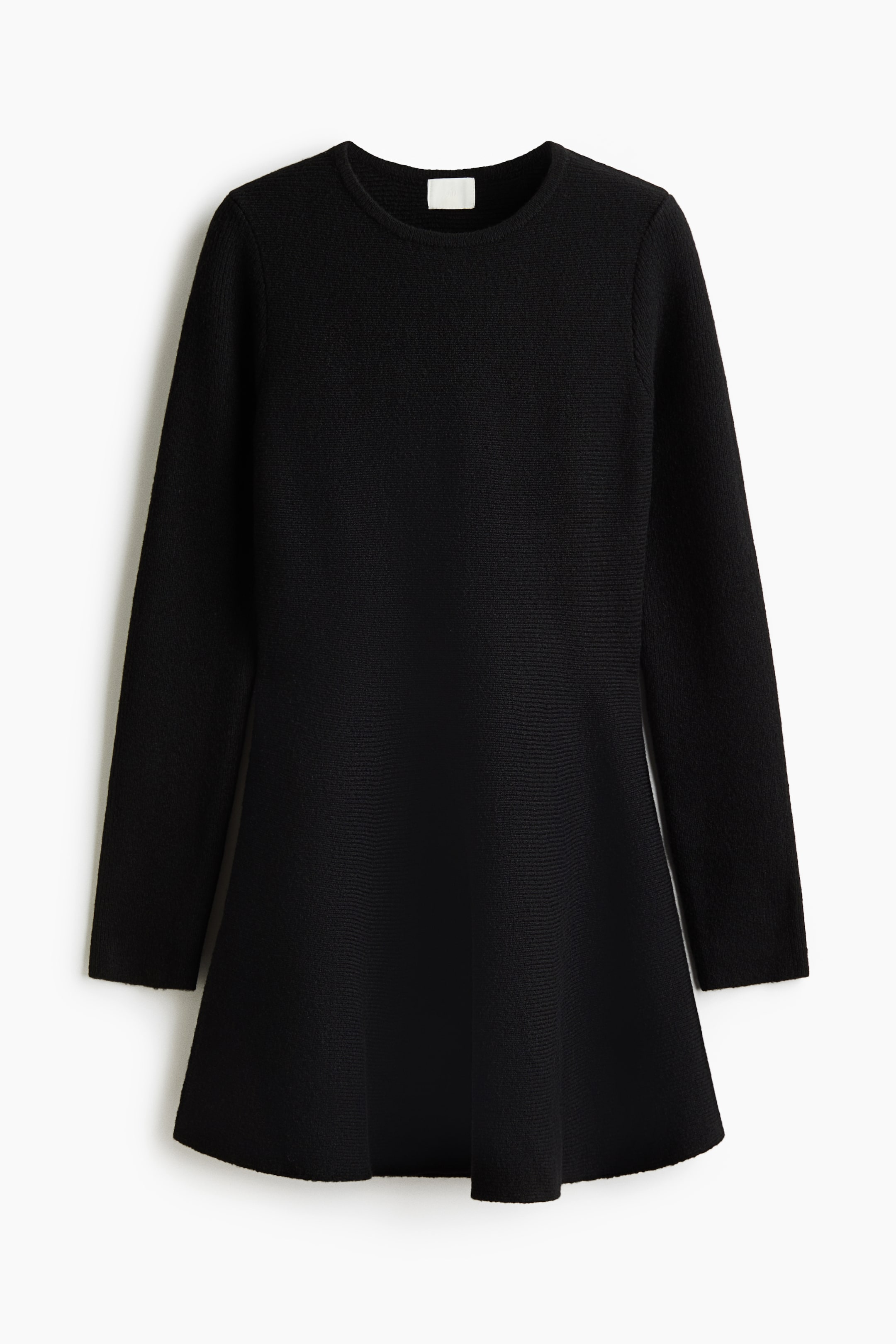 View larger image: A short black dress is shown from the front, featuring a soft horizontal rib knit with a round neckline and long sleeves. The design features a fitted bodice that flows into a flared A-line skirt.