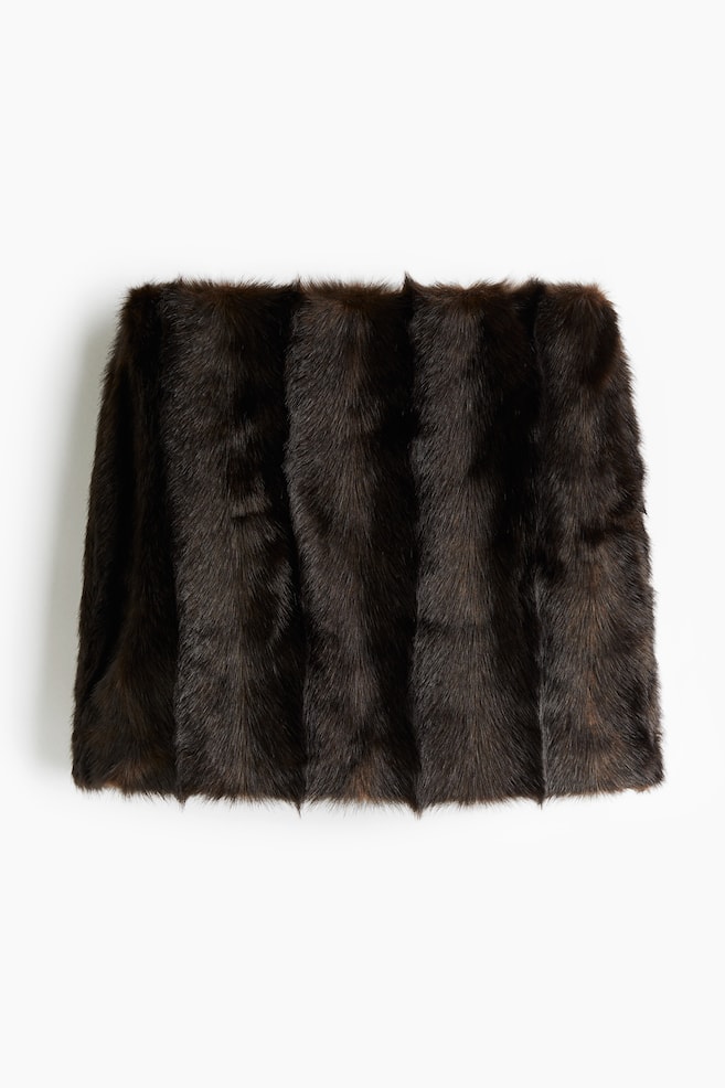 A dark brown mini skirt, featuring a soft, fluffy texture, is displaying vertical panels across its front. - 1