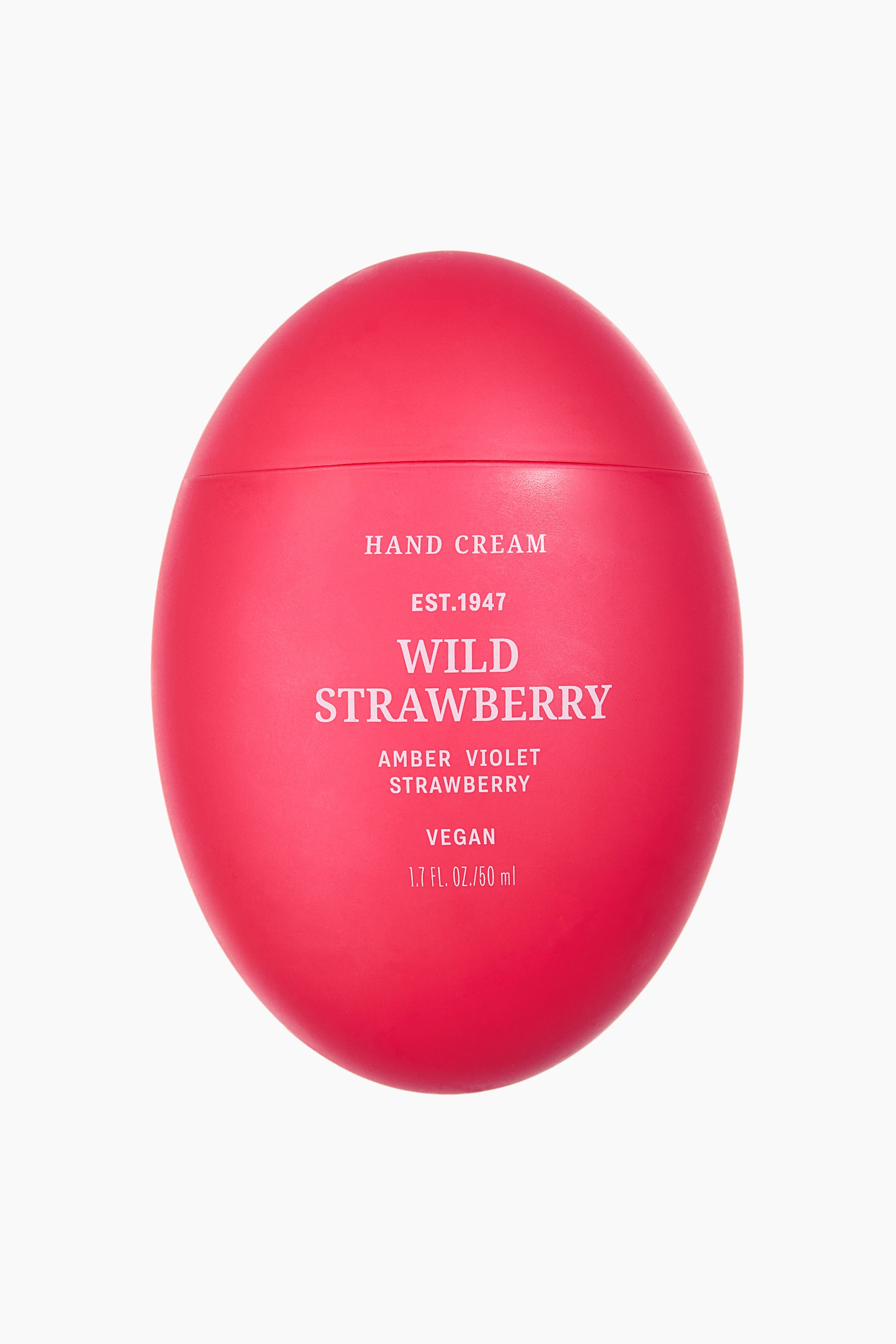 View larger image: A vibrant red, oval hand cream container is shown from the front, featuring white text that reads "WILD STRAWBERRY" along with additional product details.