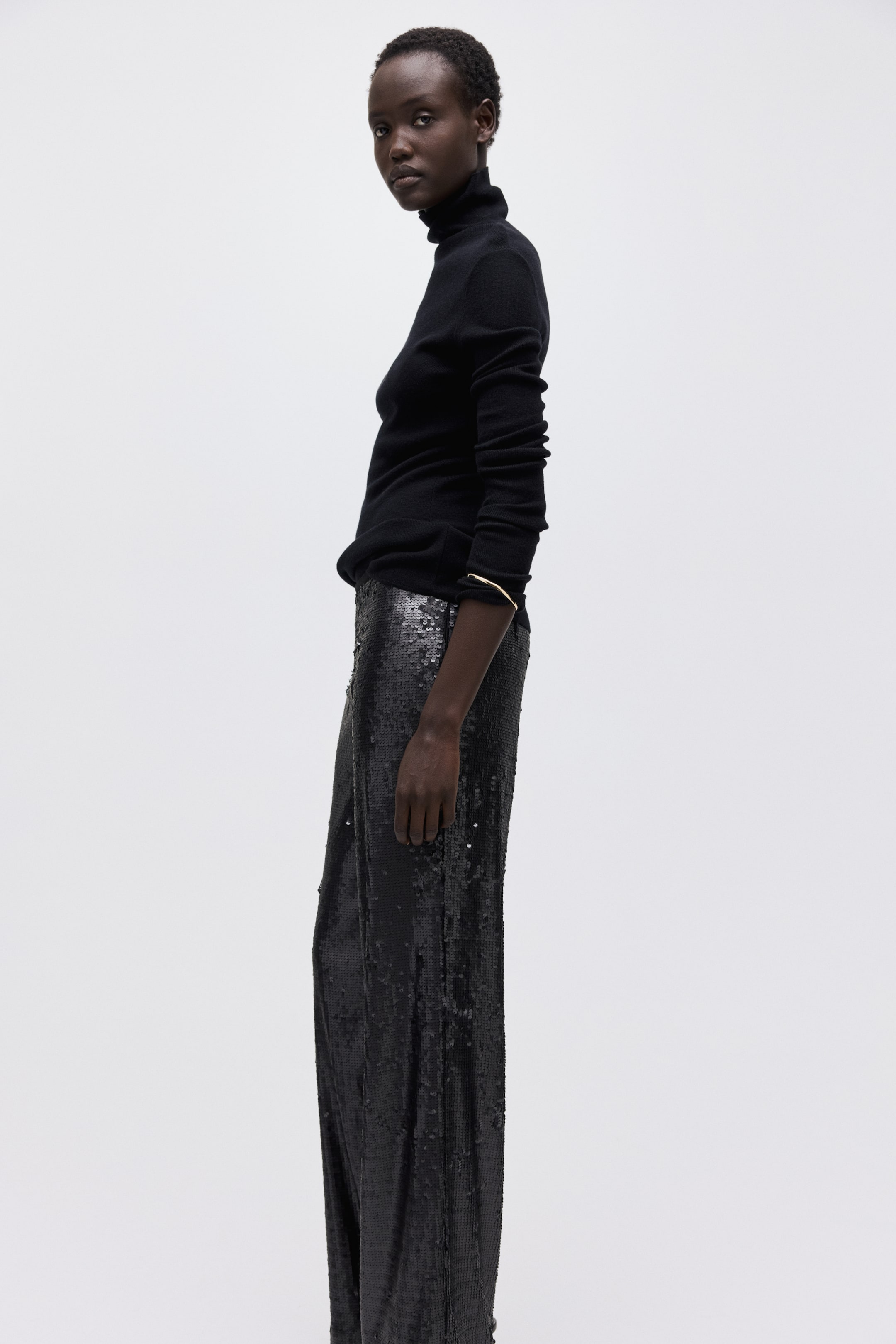 Näytä suurempi kuva: Paljettikoristeiset housut - Musta - NAISET | H&M FI 3